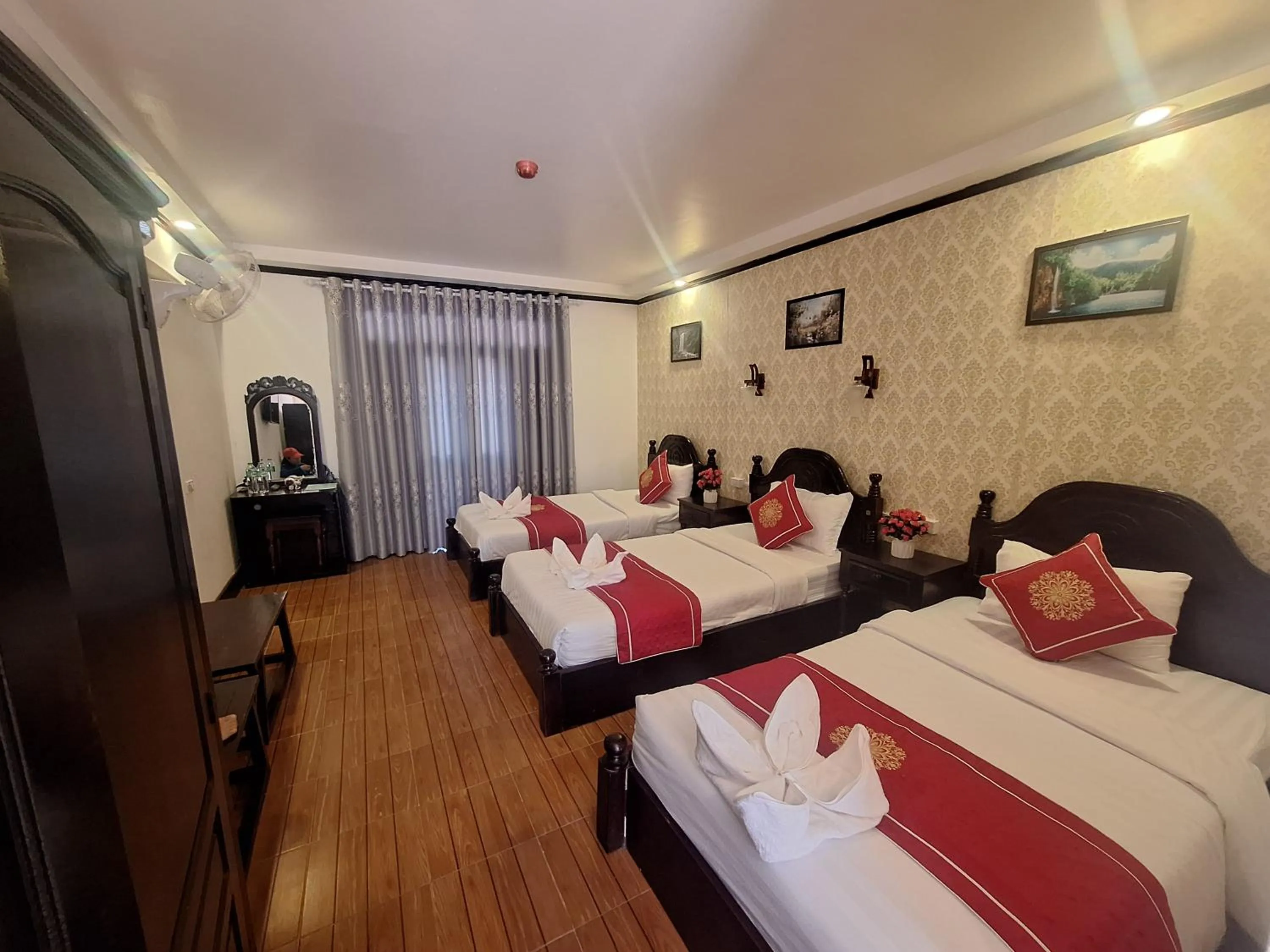 Bed in Luang Prabang Pavilion Hotel & Travel