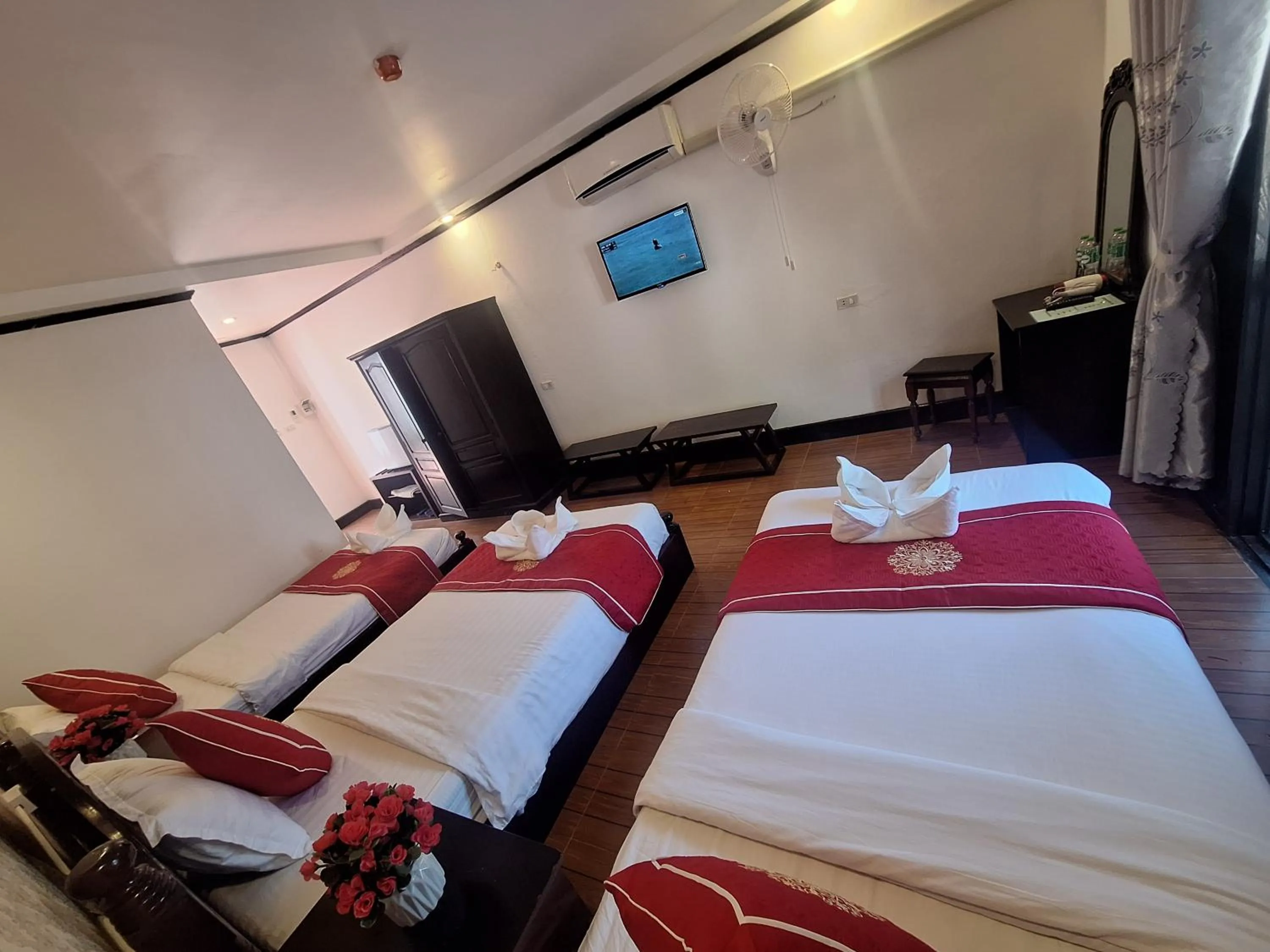 Bed in Luang Prabang Pavilion Hotel & Travel