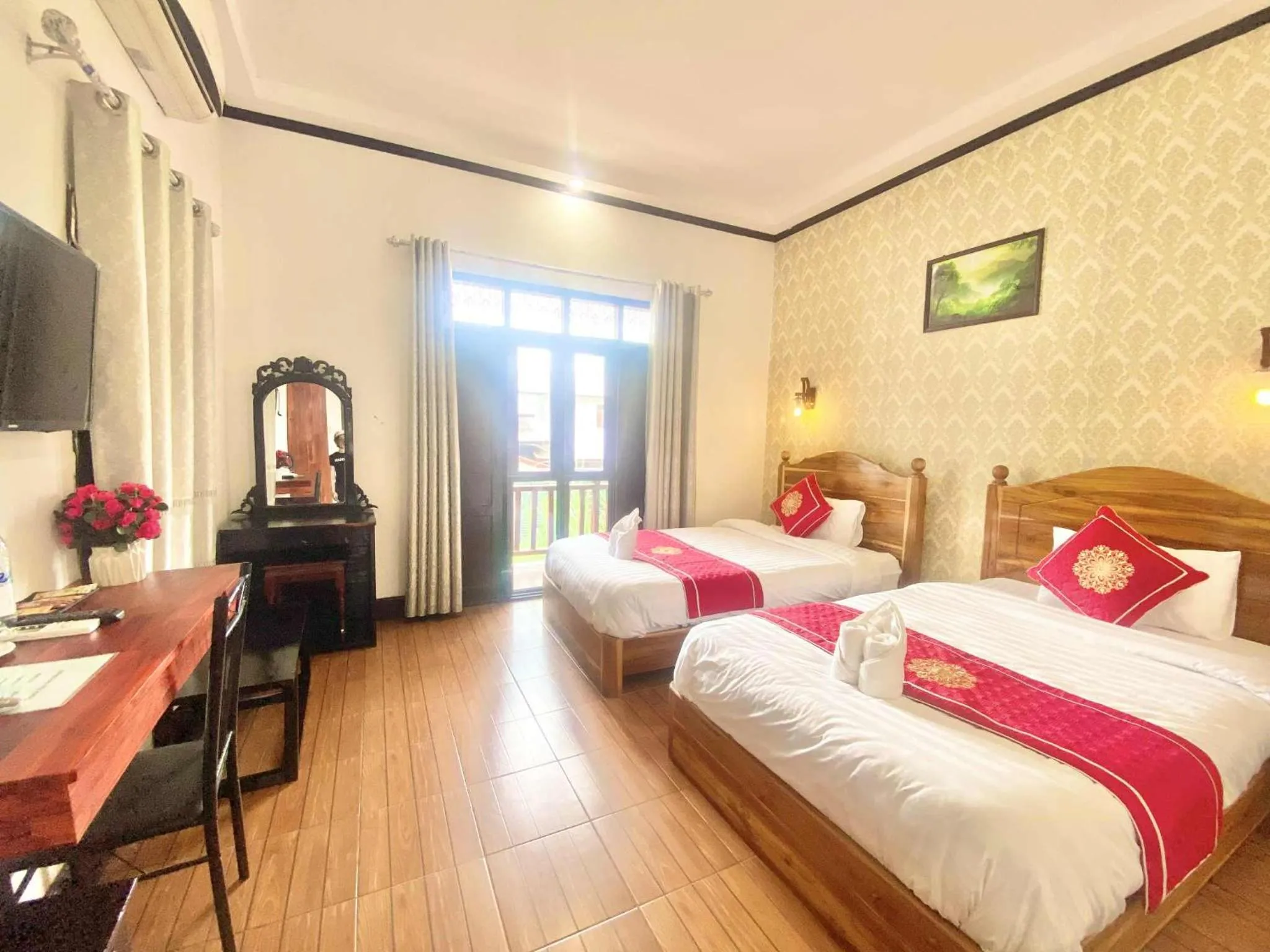 Bed in Luang Prabang Pavilion Hotel & Travel