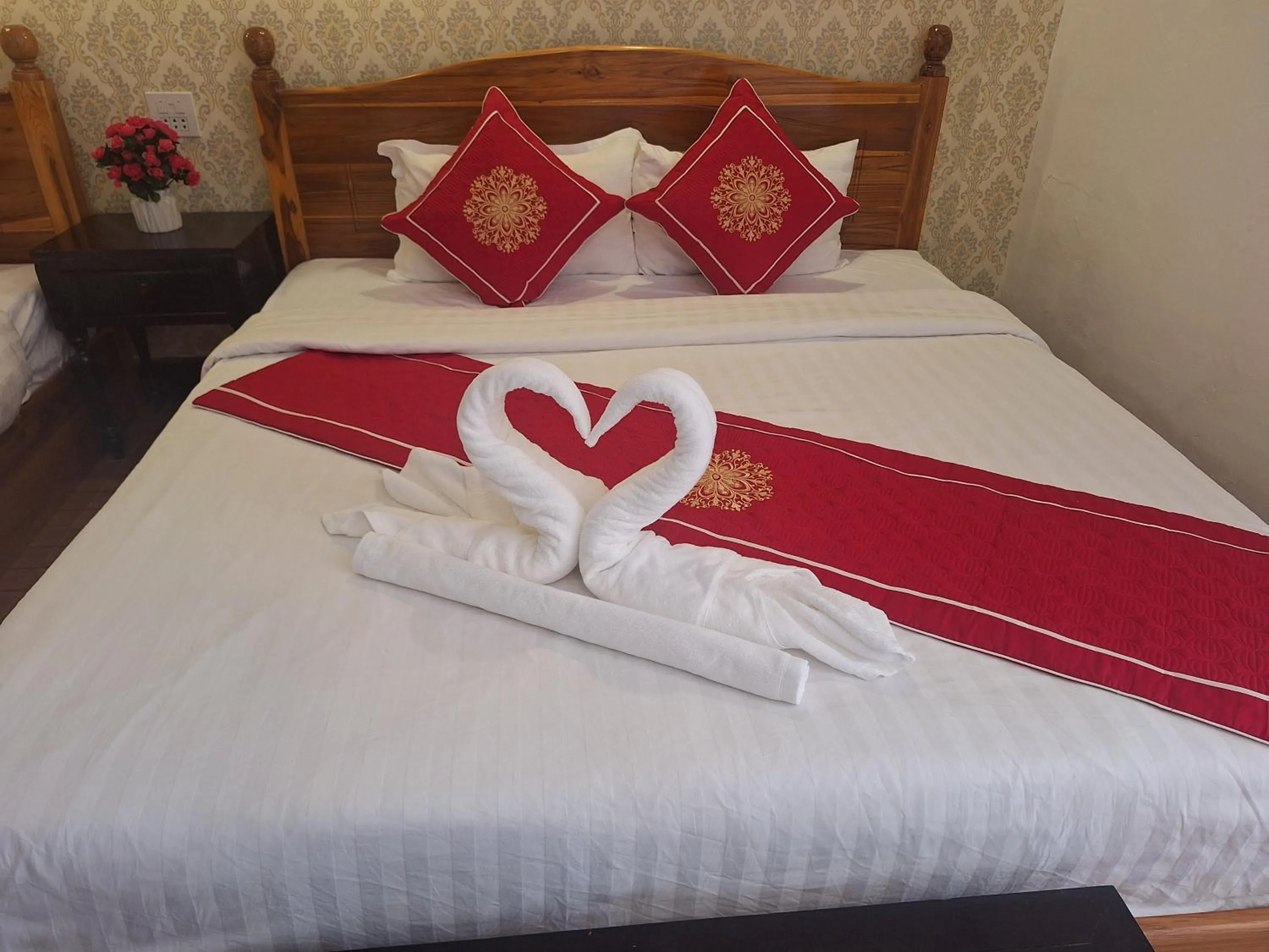 Bed in Luang Prabang Pavilion Hotel & Travel