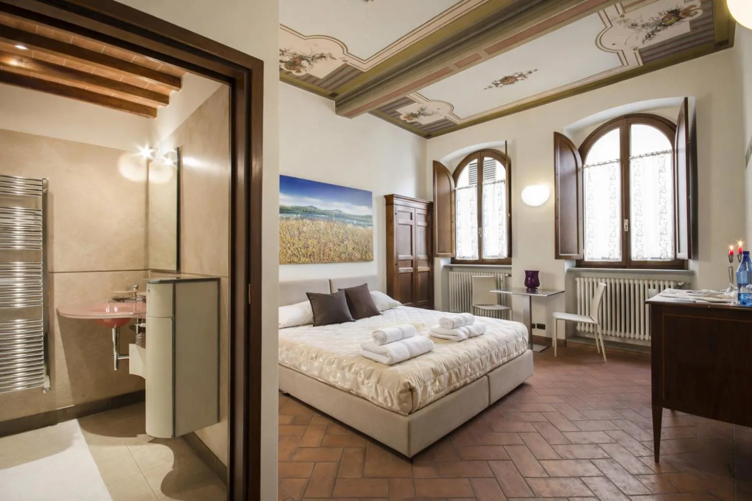 Bed in La Corte Del Re Suite & Rooms Arezzo