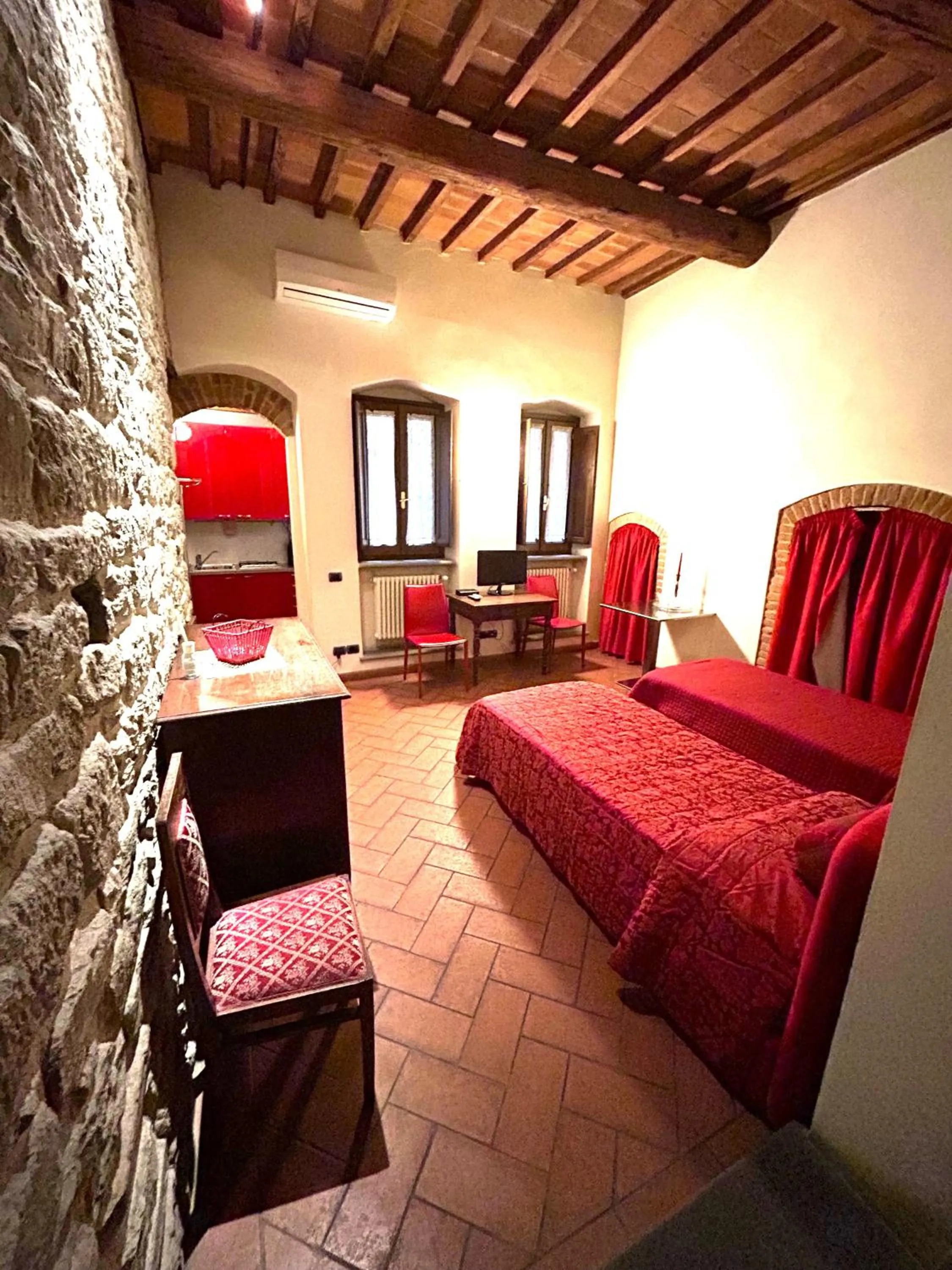 Bed in La Corte Del Re Suite & Rooms Arezzo