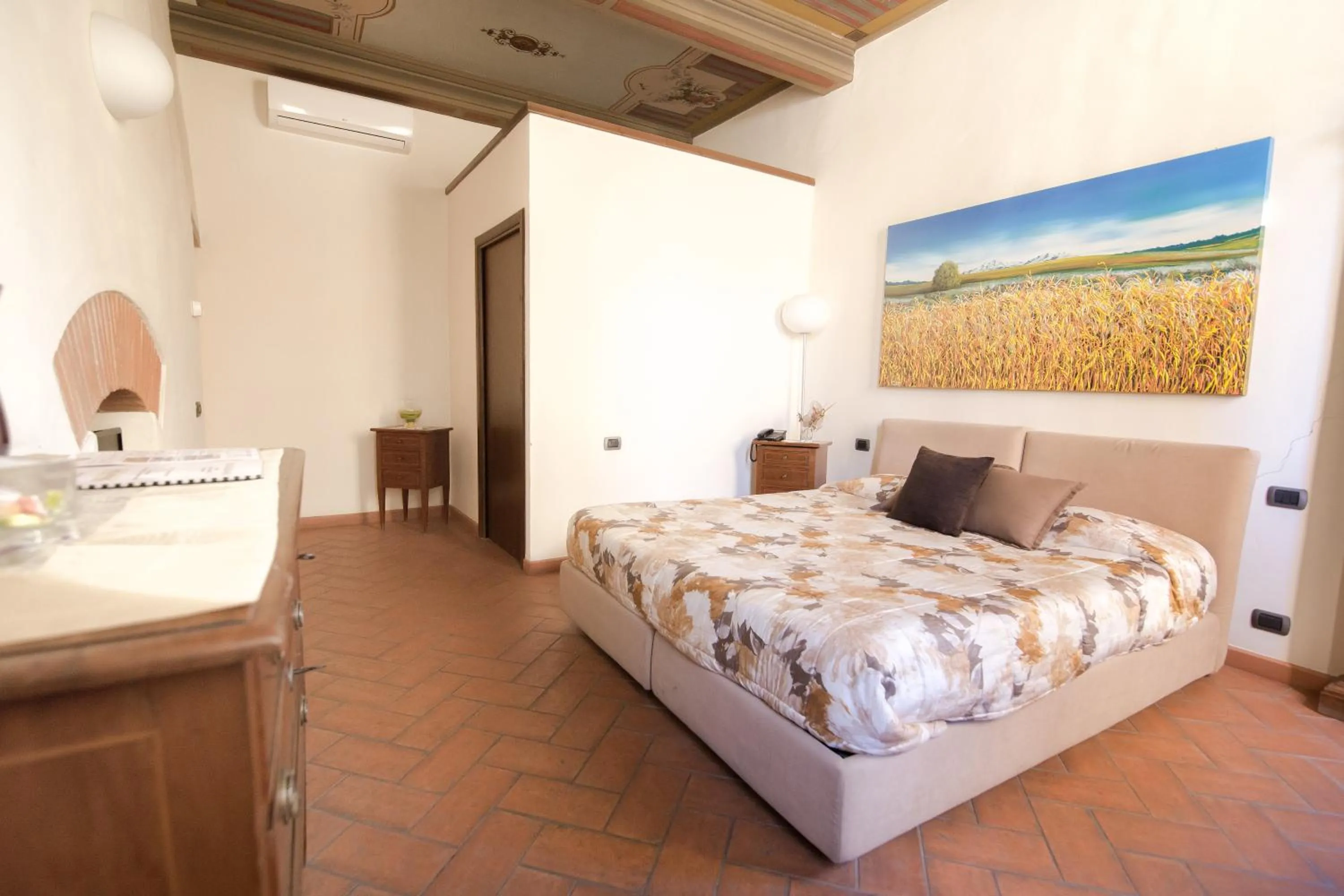 Bed in La Corte Del Re Suite & Rooms Arezzo