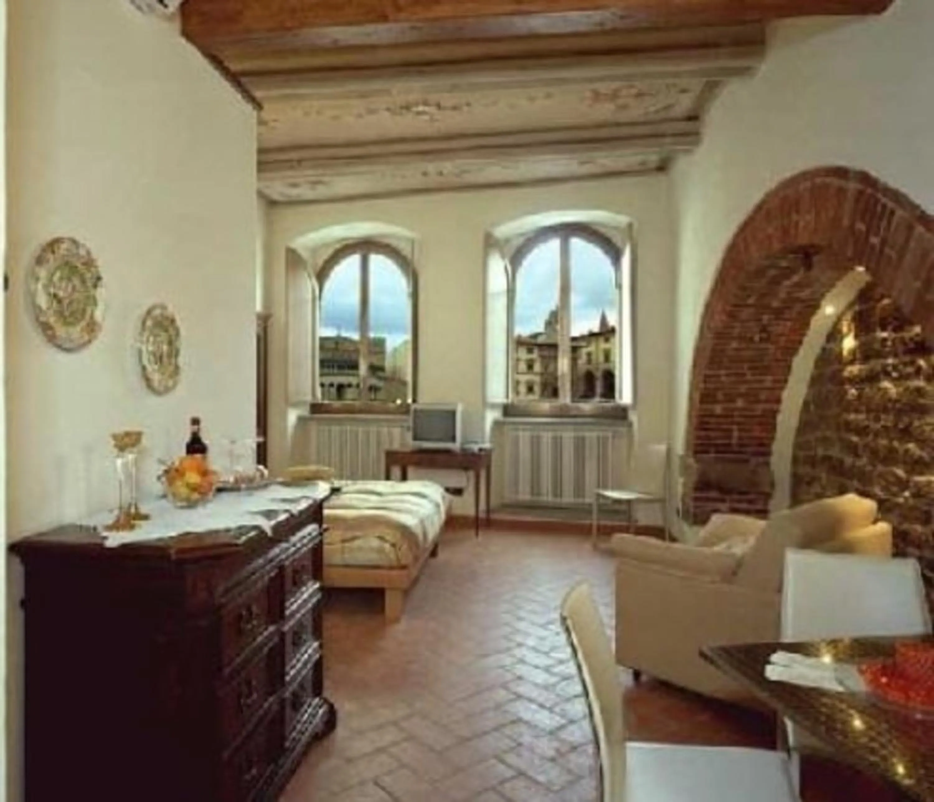 Seating area, Bed in La Corte Del Re Suite & Rooms Arezzo