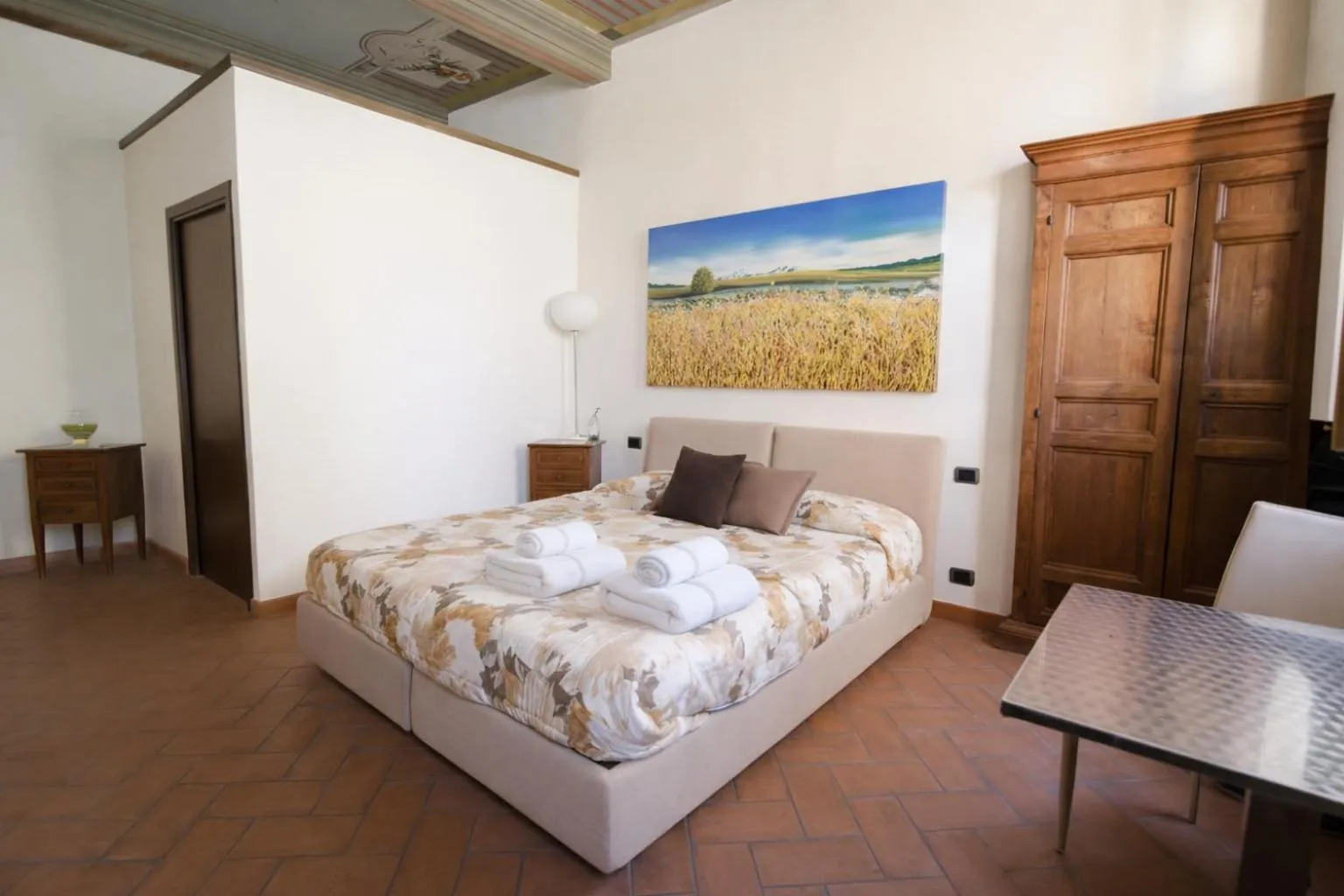 Bed in La Corte Del Re Suite & Rooms Arezzo