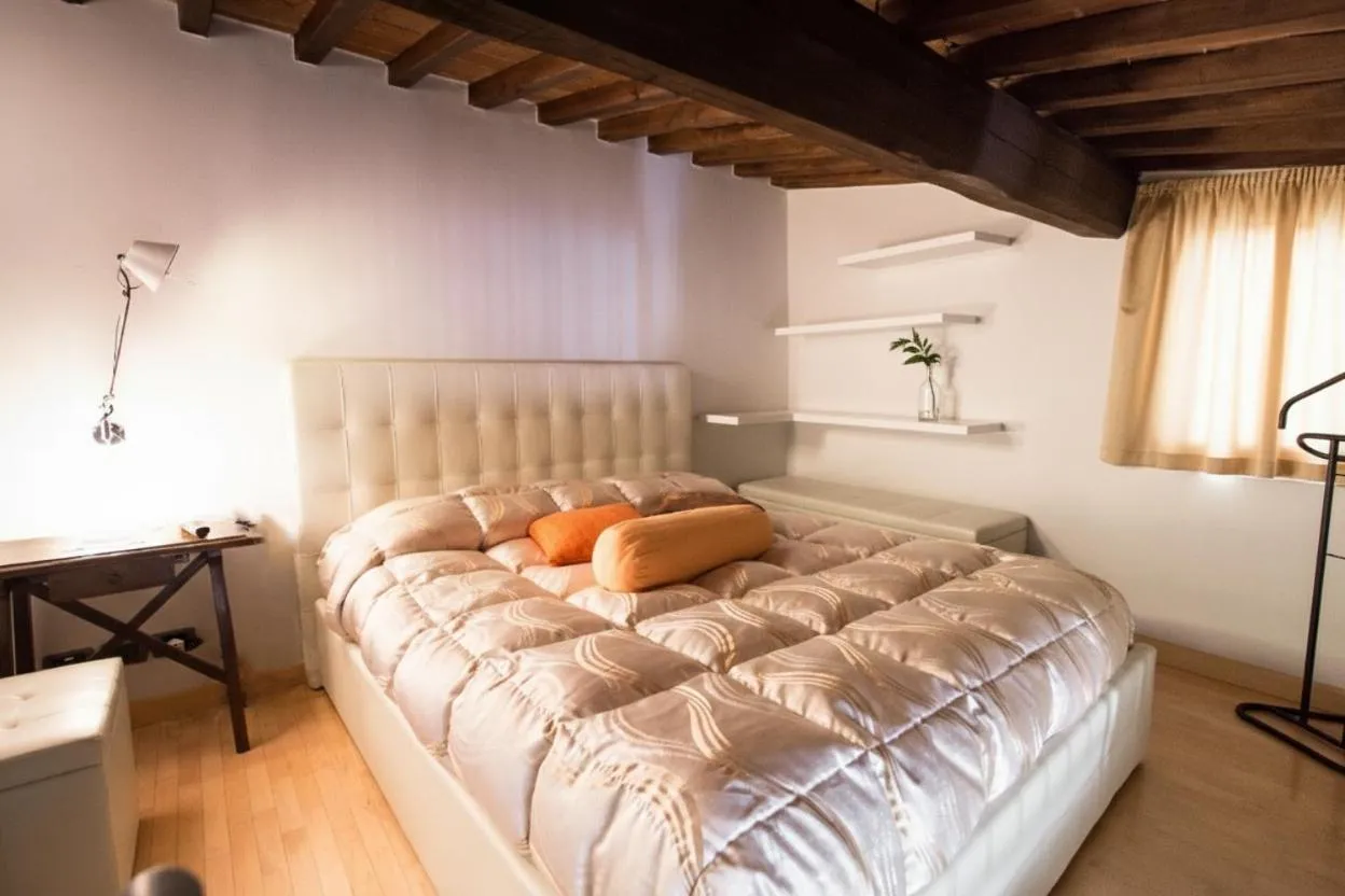 Bed in La Corte Del Re Suite & Rooms Arezzo