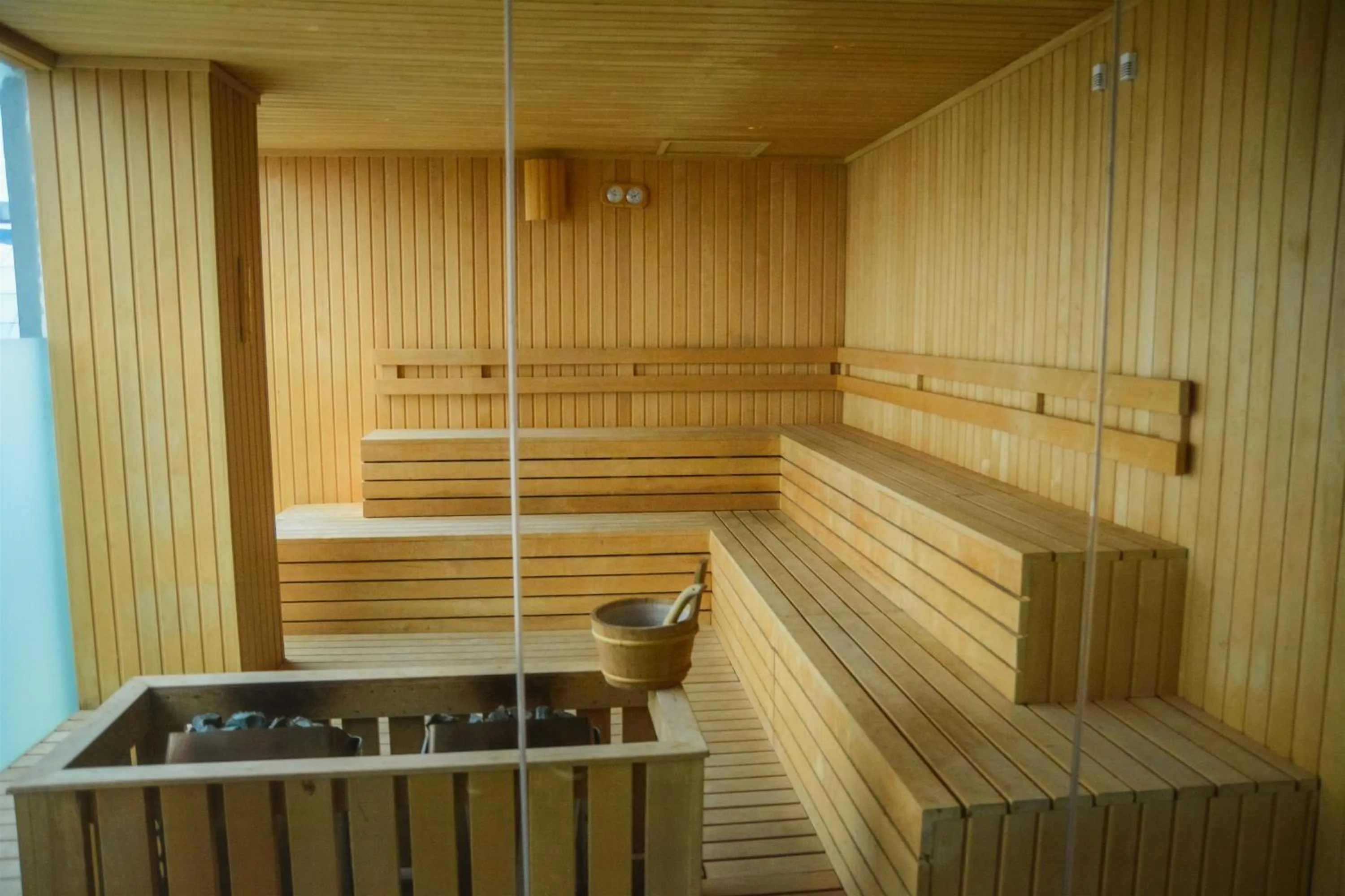 Sauna in Modern Elegant Design 2BR L'Avenue Apartment By Travelio