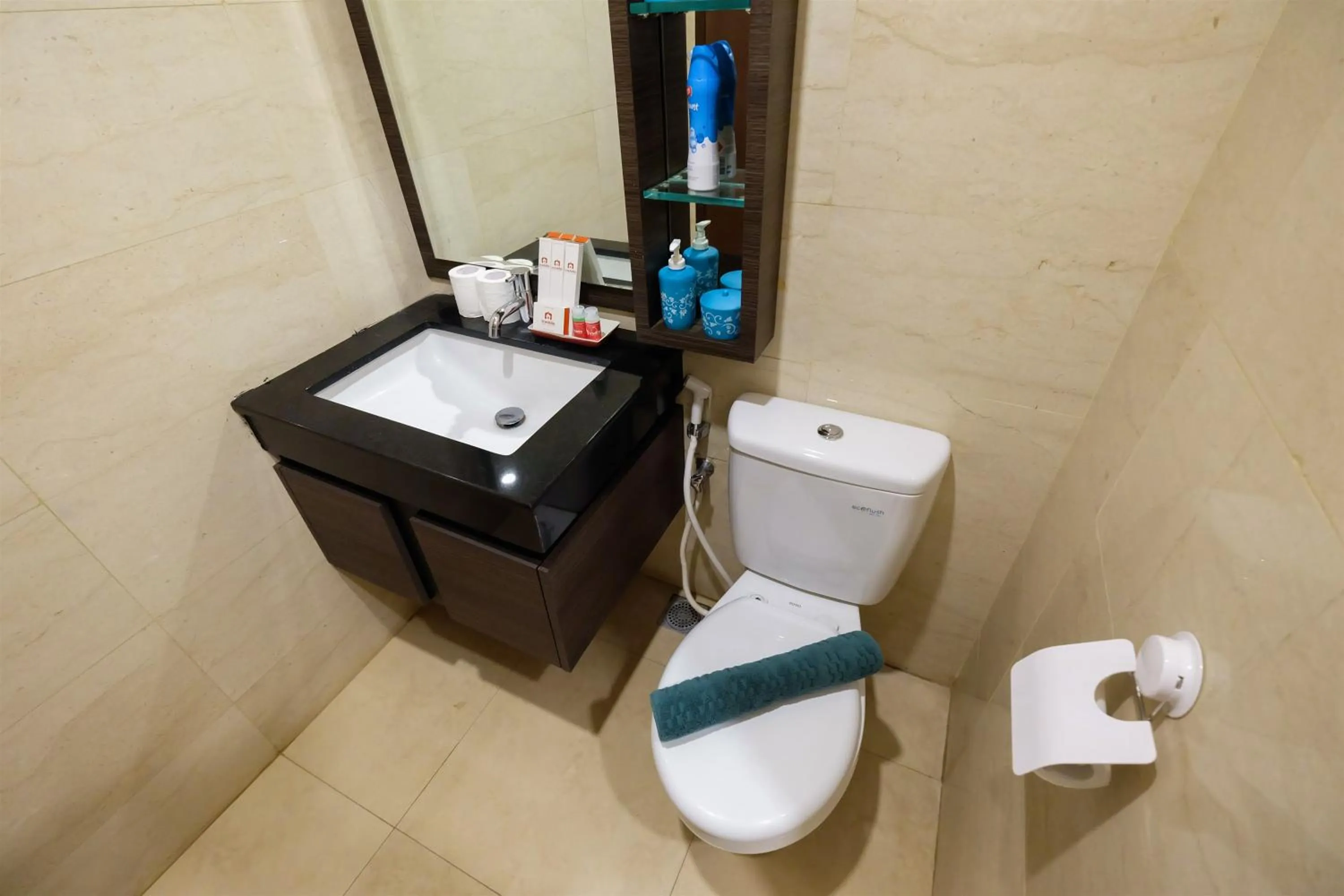 Toilet in Modern Elegant Design 2BR L'Avenue Apartment By Travelio