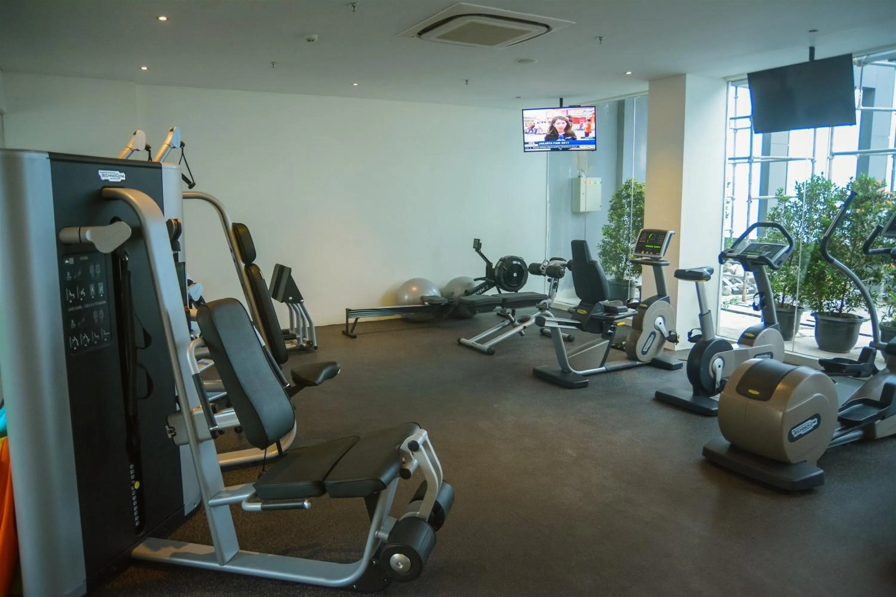 Fitness centre/facilities in Modern Elegant Design 2BR L'Avenue Apartment By Travelio