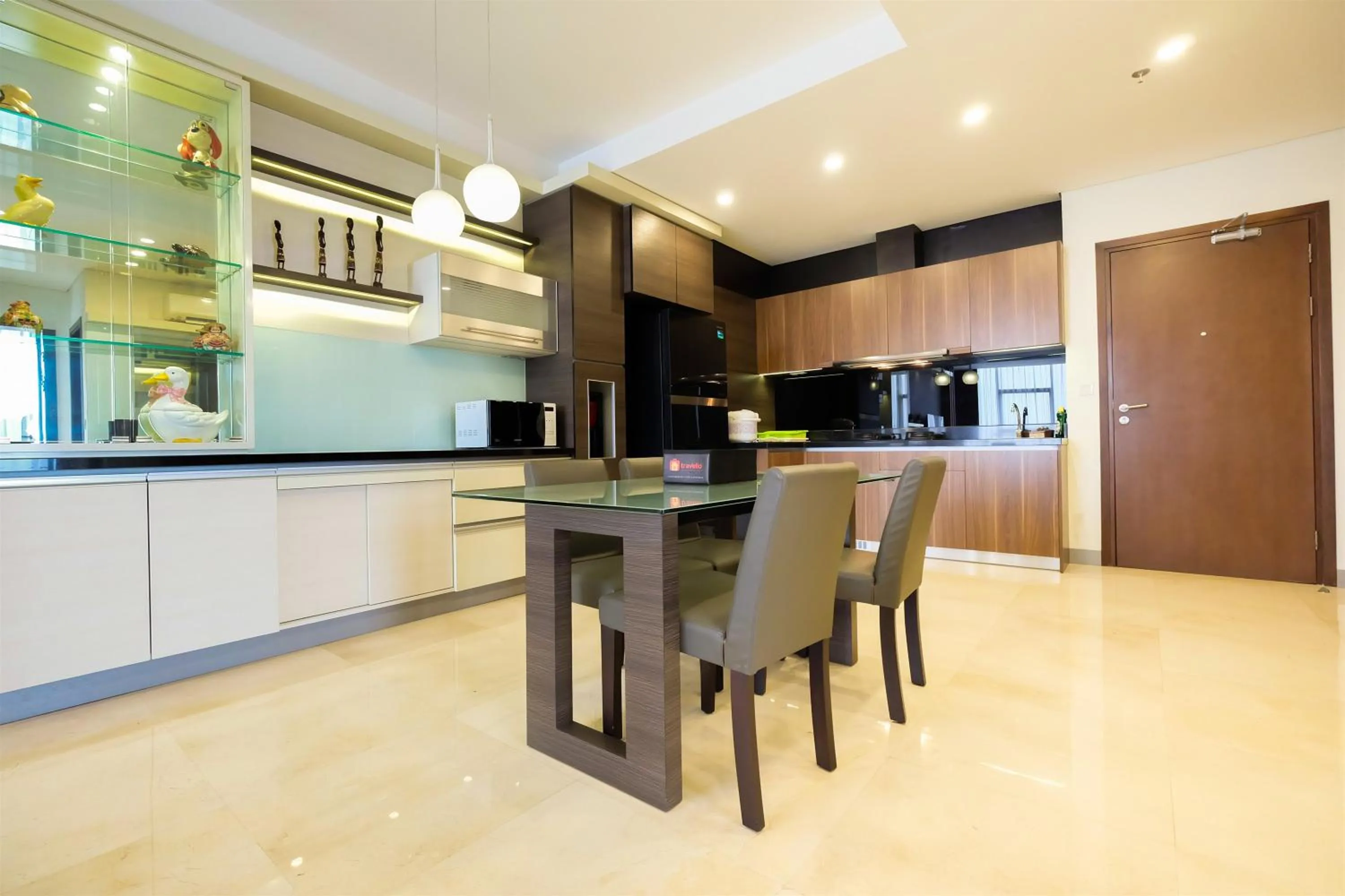 Kitchen or kitchenette in Modern Elegant Design 2BR L'Avenue Apartment By Travelio