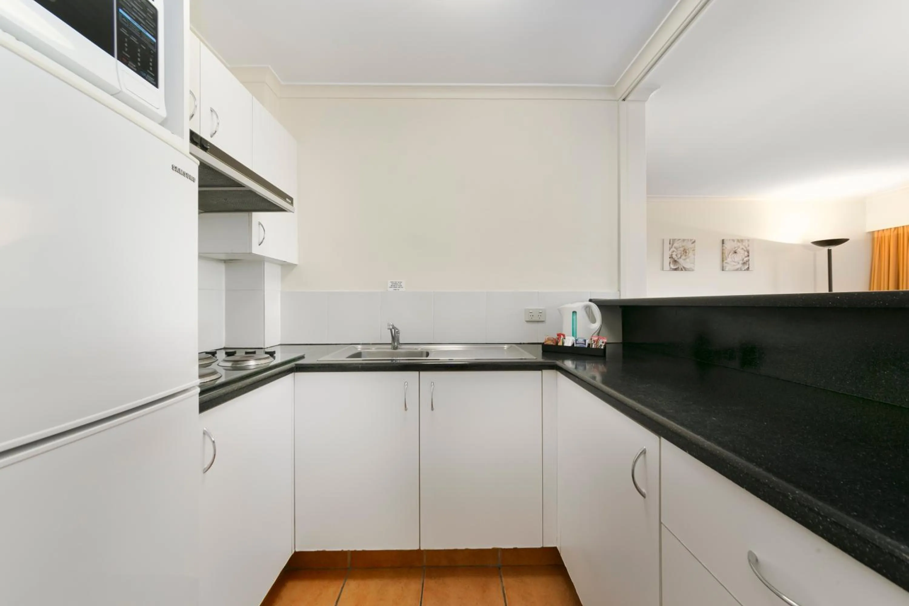 Kitchen or kitchenette in Mt Ommaney Hotel Apartments