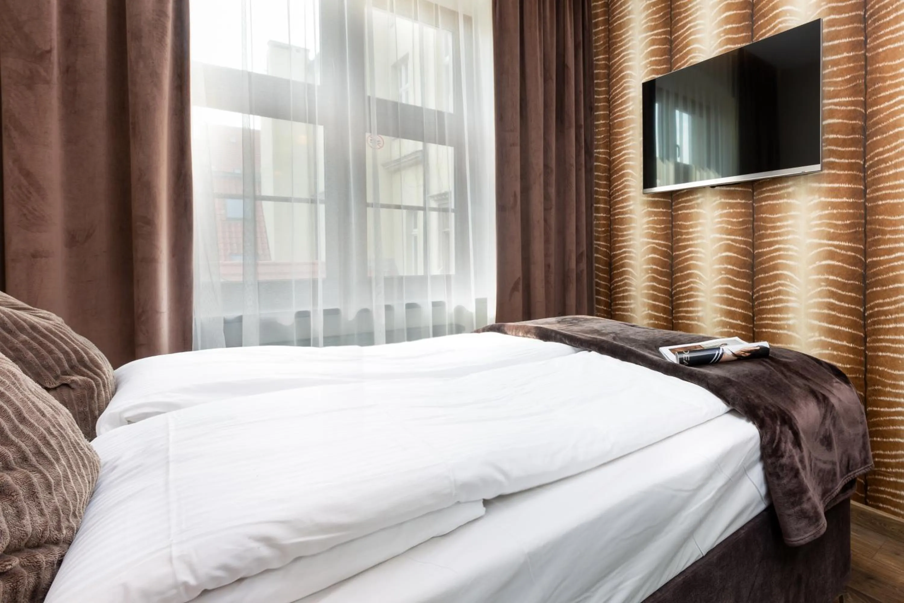 Bed in Aparthotel New Lux