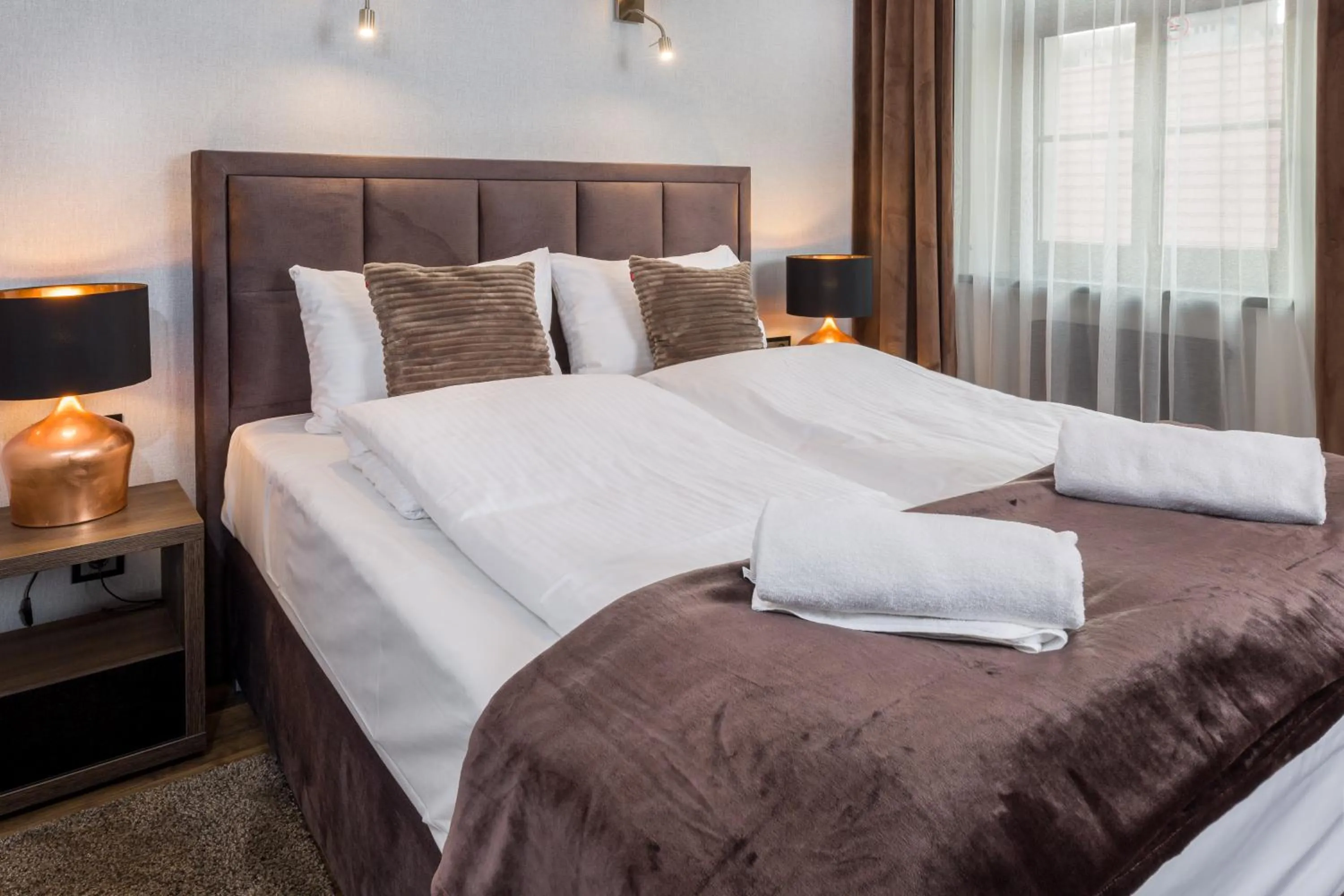 Bed in Aparthotel New Lux