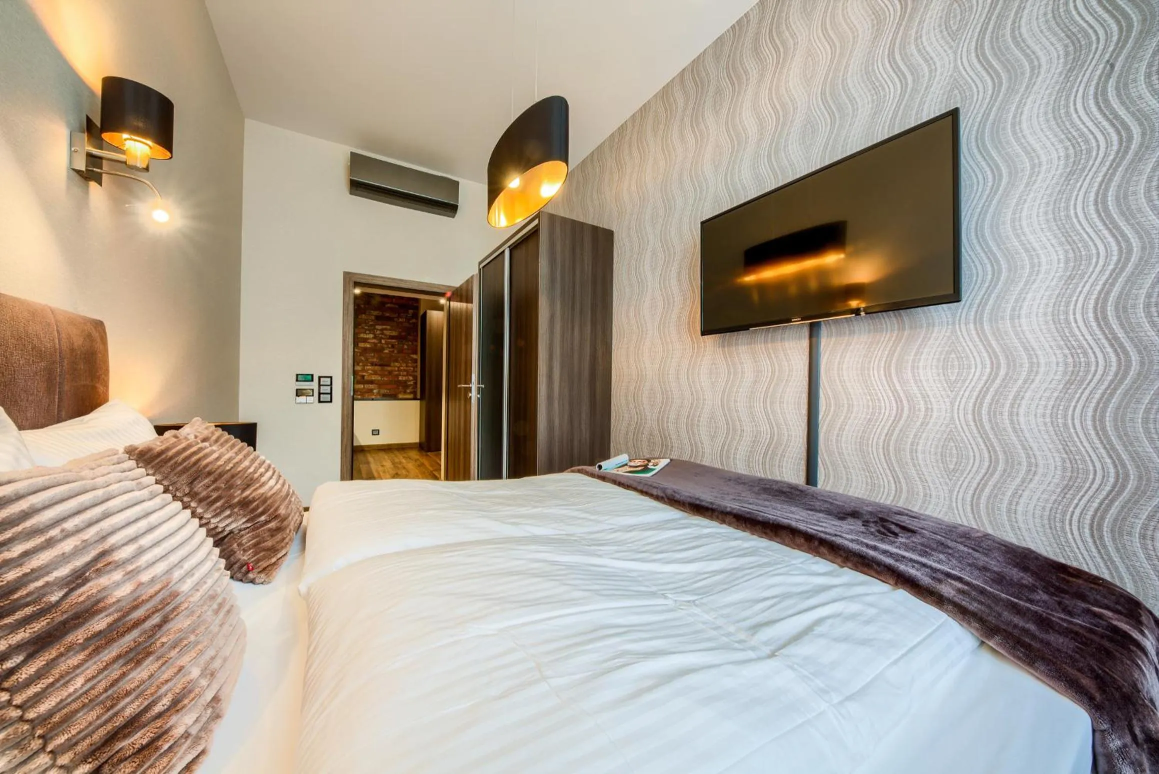 Bed in Aparthotel New Lux