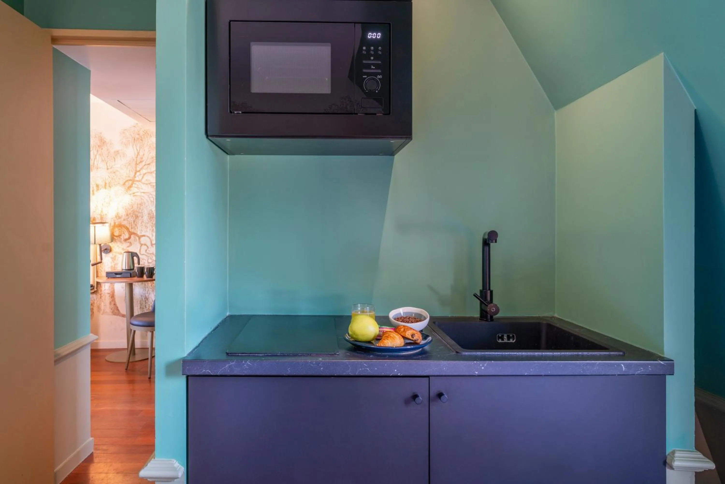 Kitchen or kitchenette in Appart Hotel Avalon