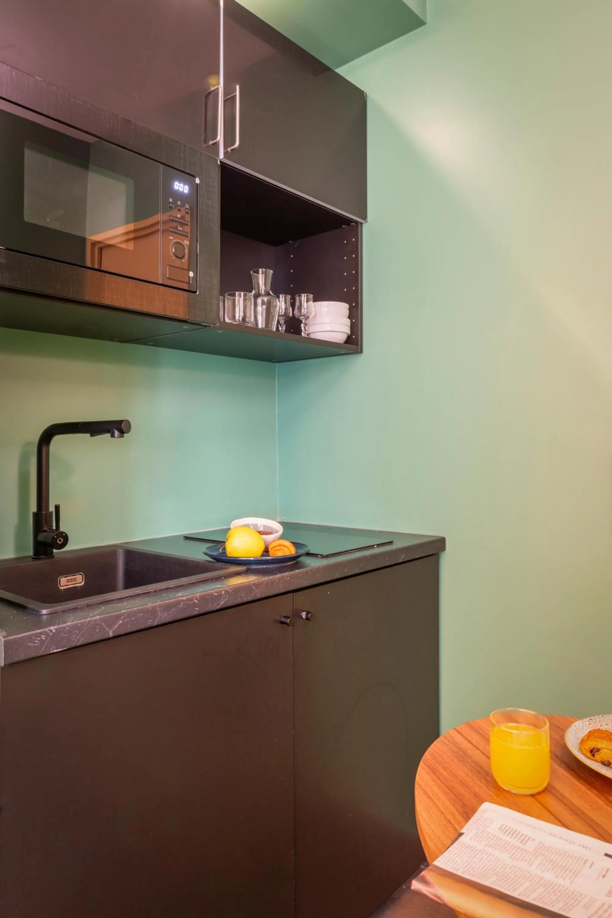 Kitchen or kitchenette in Appart Hotel Avalon