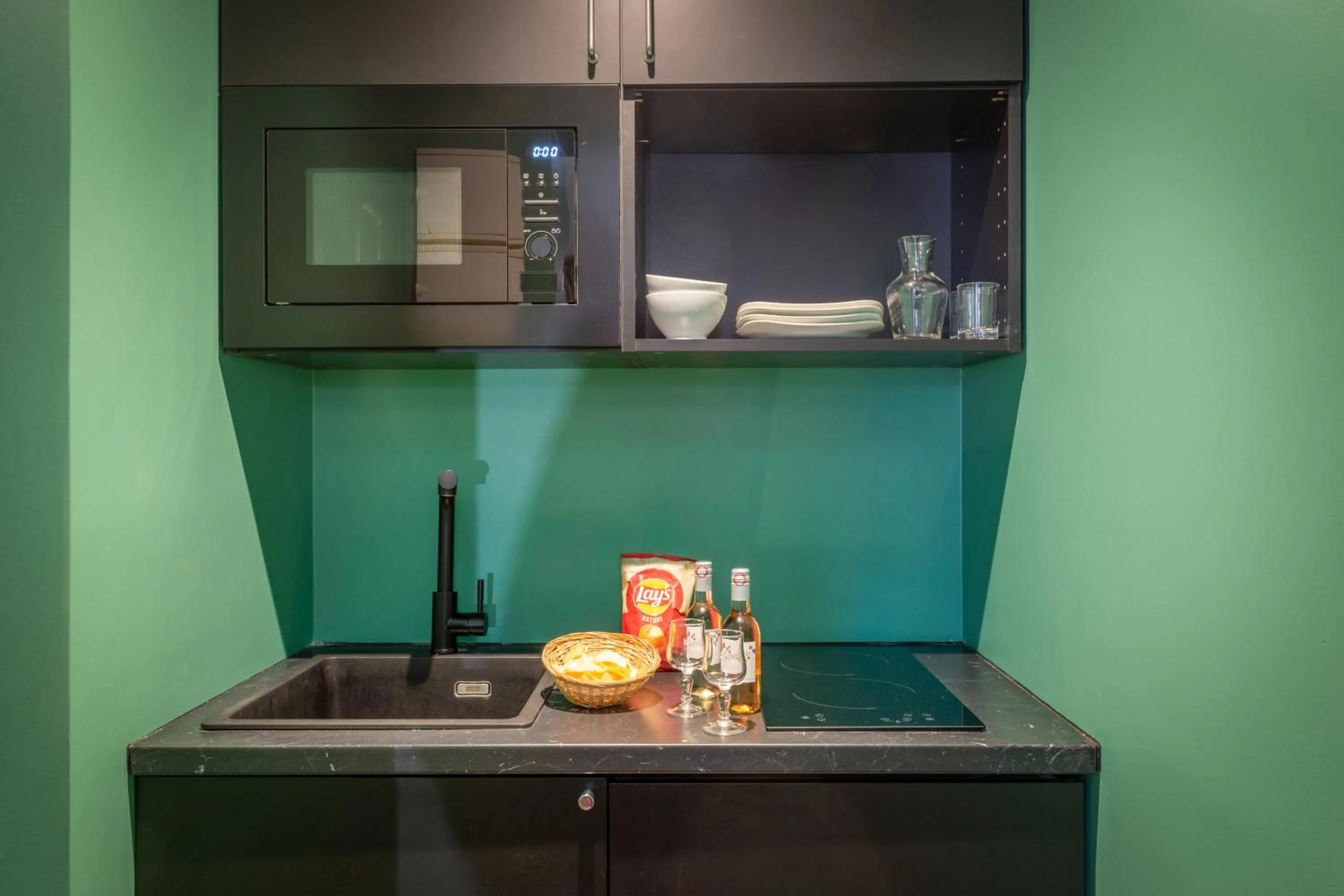 Kitchen or kitchenette in Appart Hotel Avalon