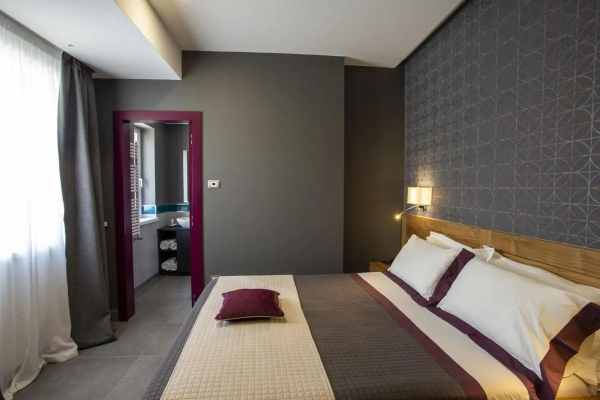 Garden view, Bed in La Vigna Hotel