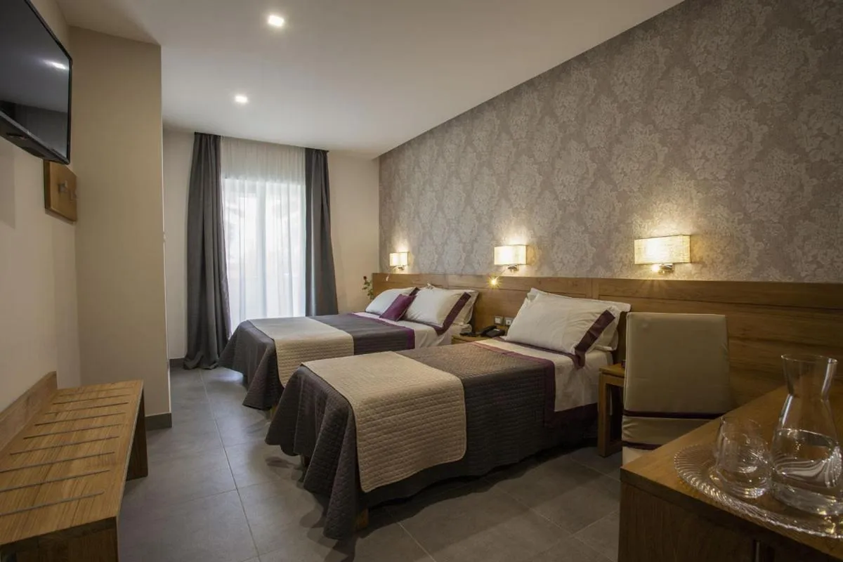 Garden view, Bed in La Vigna Hotel