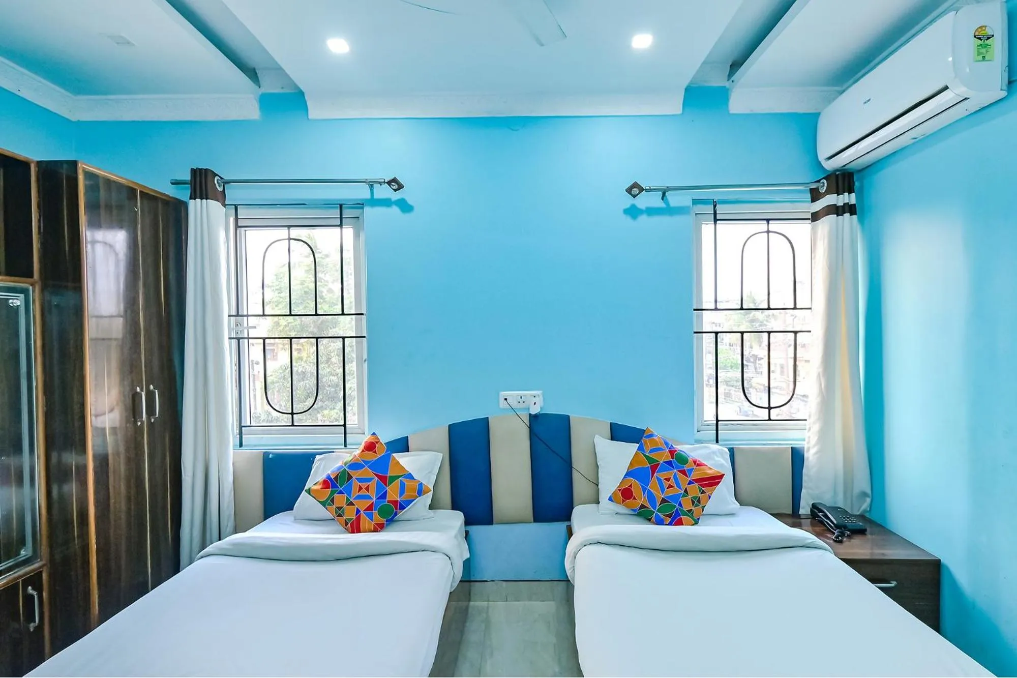 Bed in FabHotel Good Luck Residency