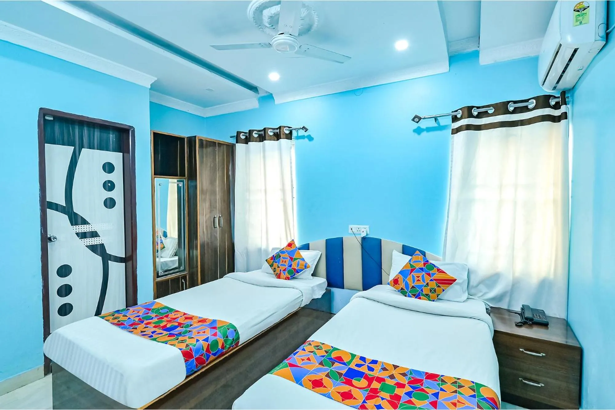 Bed in FabHotel Good Luck Residency