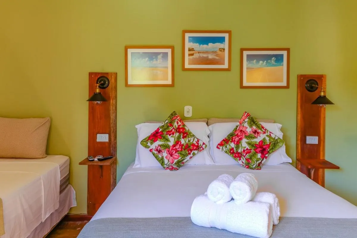 Bed in Pousada Catamara