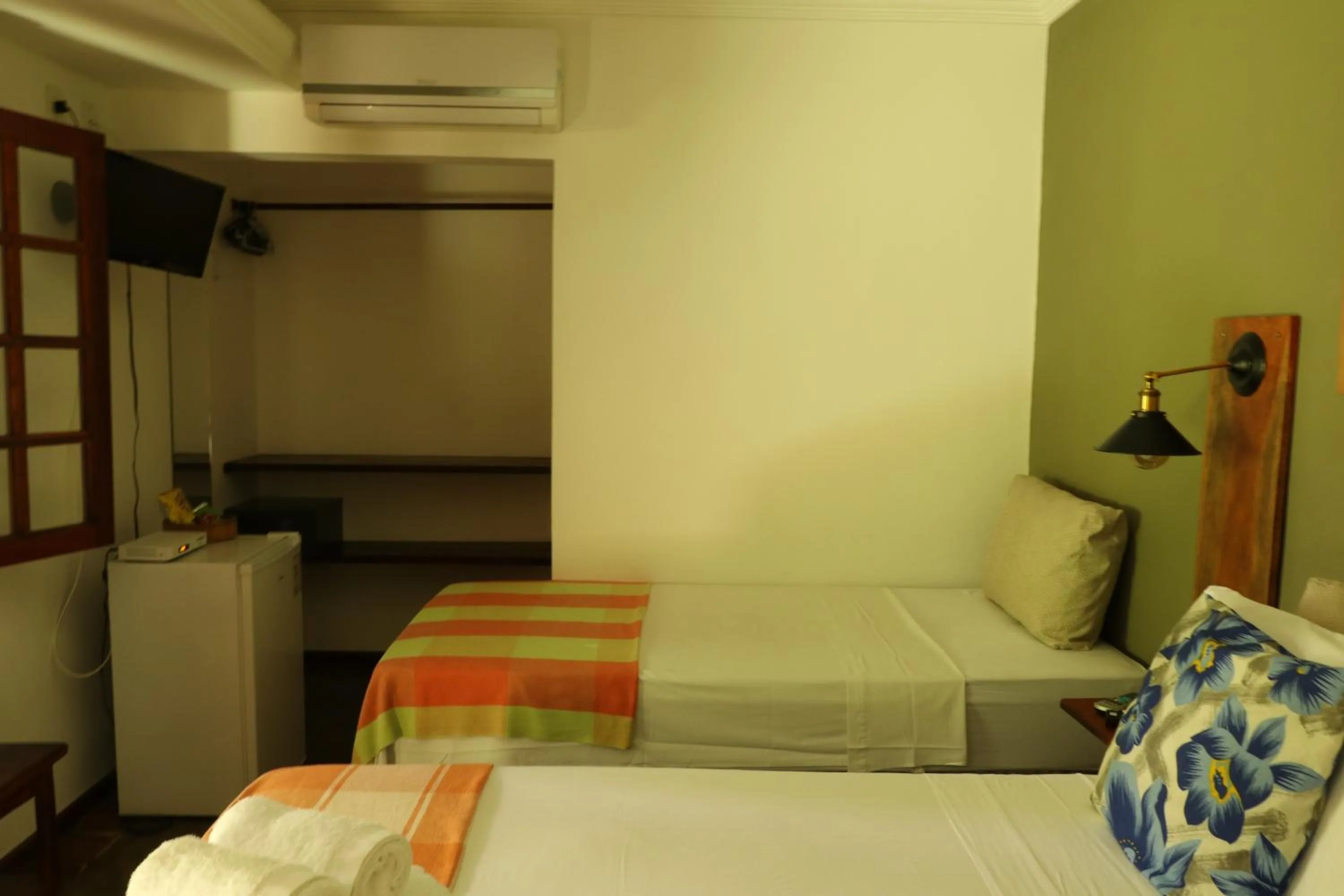 Bed in Pousada Catamara