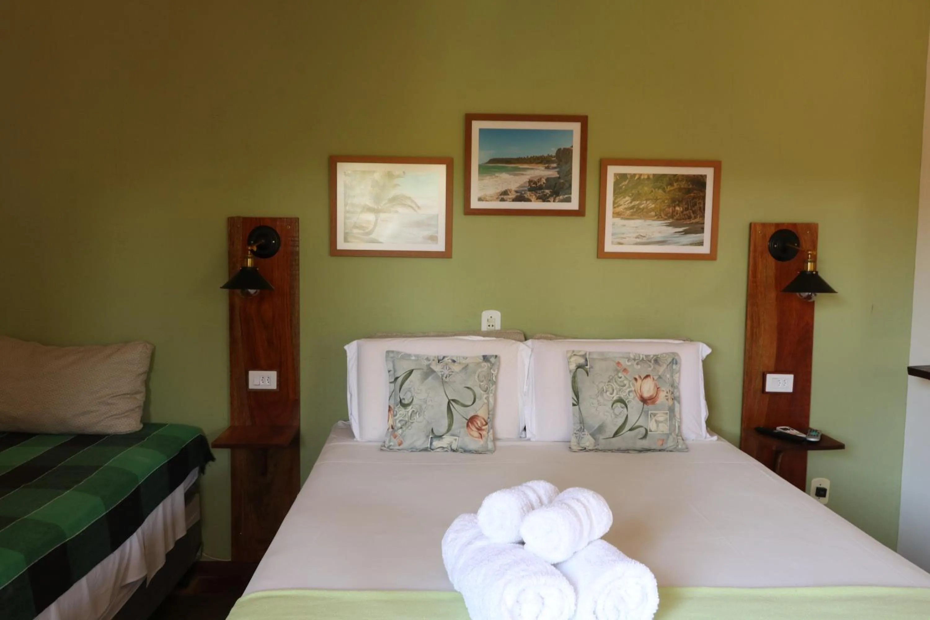 Bed in Pousada Catamara