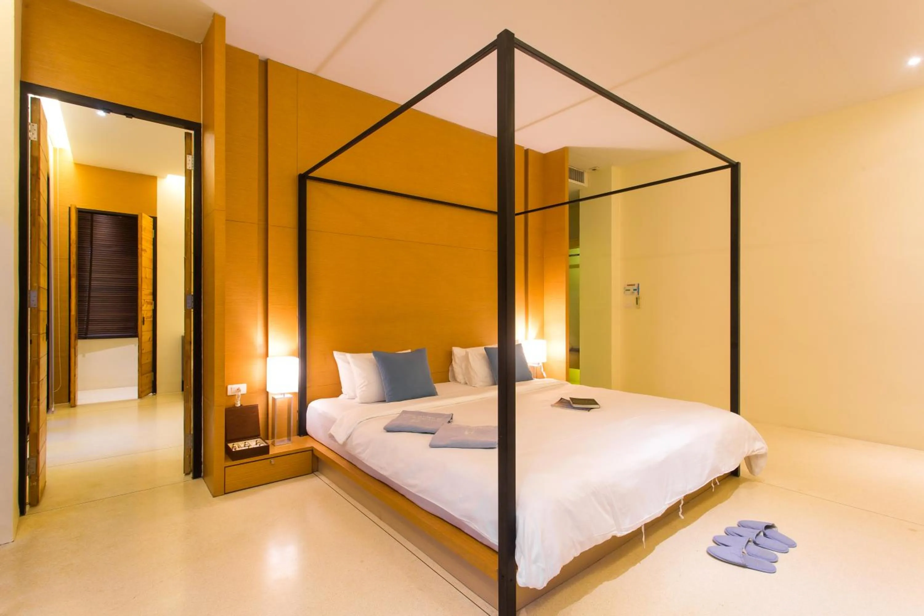 Bed in The Anda Mani Khaolak Beachfront Villas