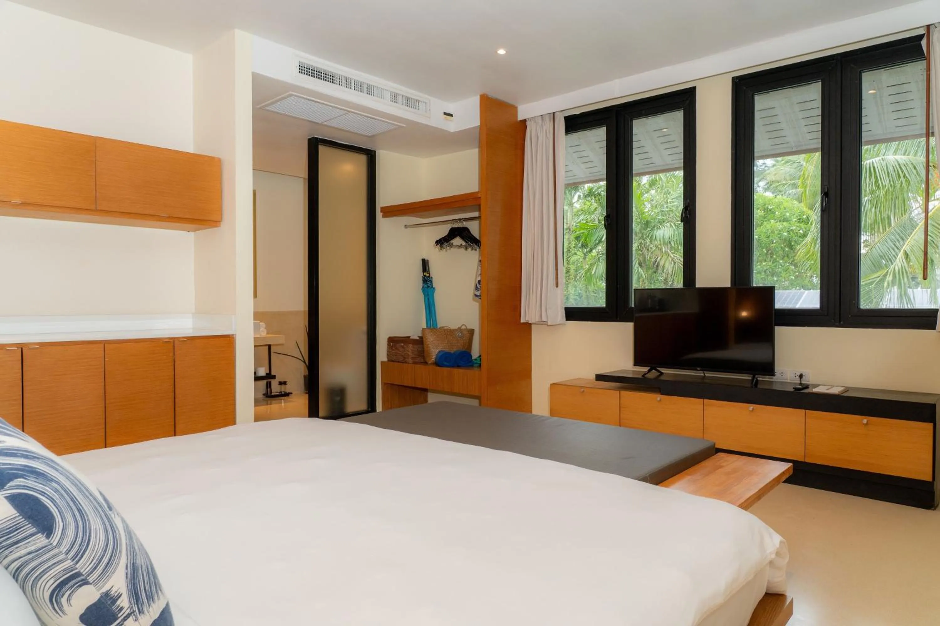 Bed in The Anda Mani Khaolak Beachfront Villas - Adult only