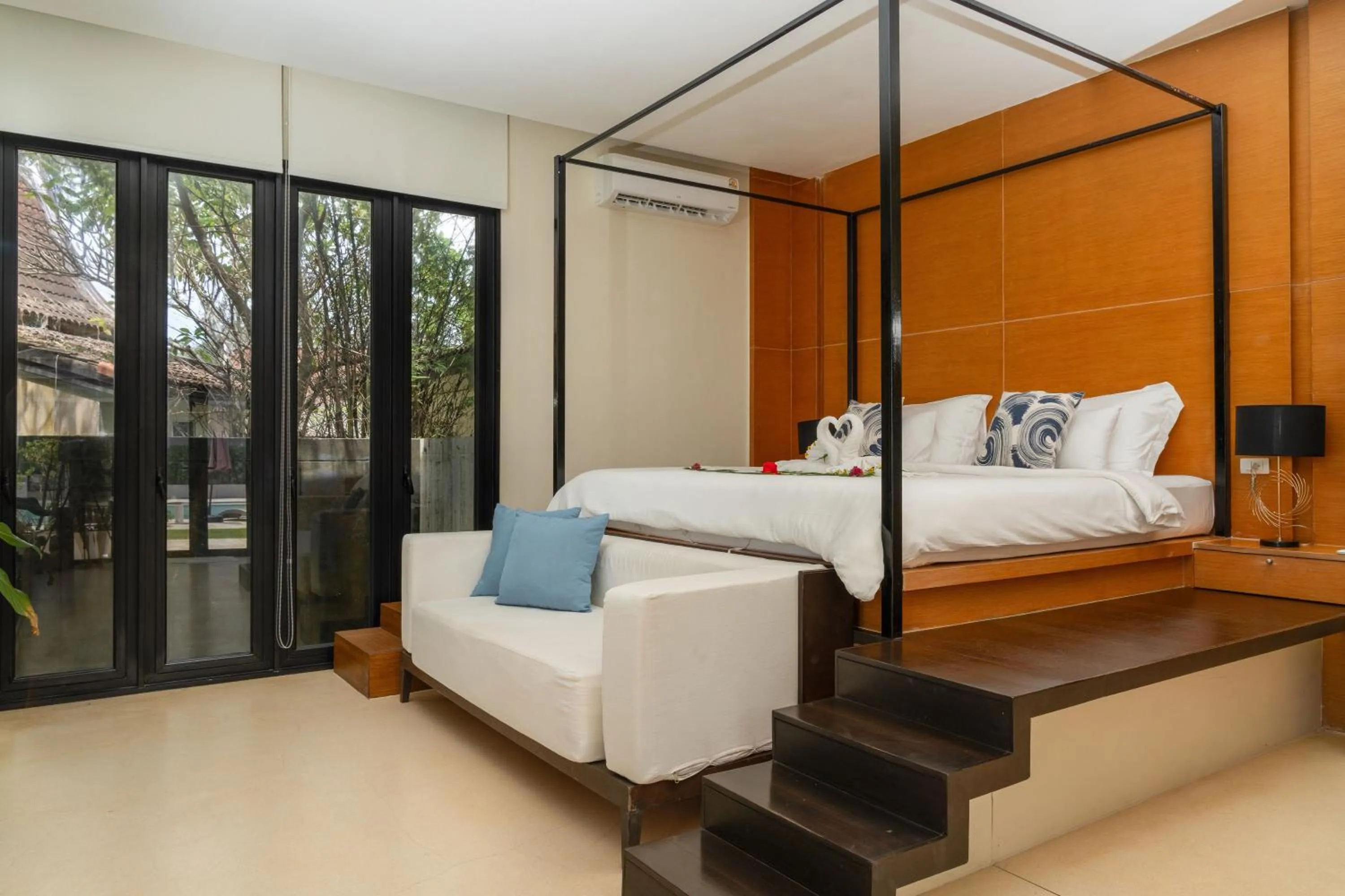 Bed in The Anda Mani Khaolak Beachfront Villas - Adult only