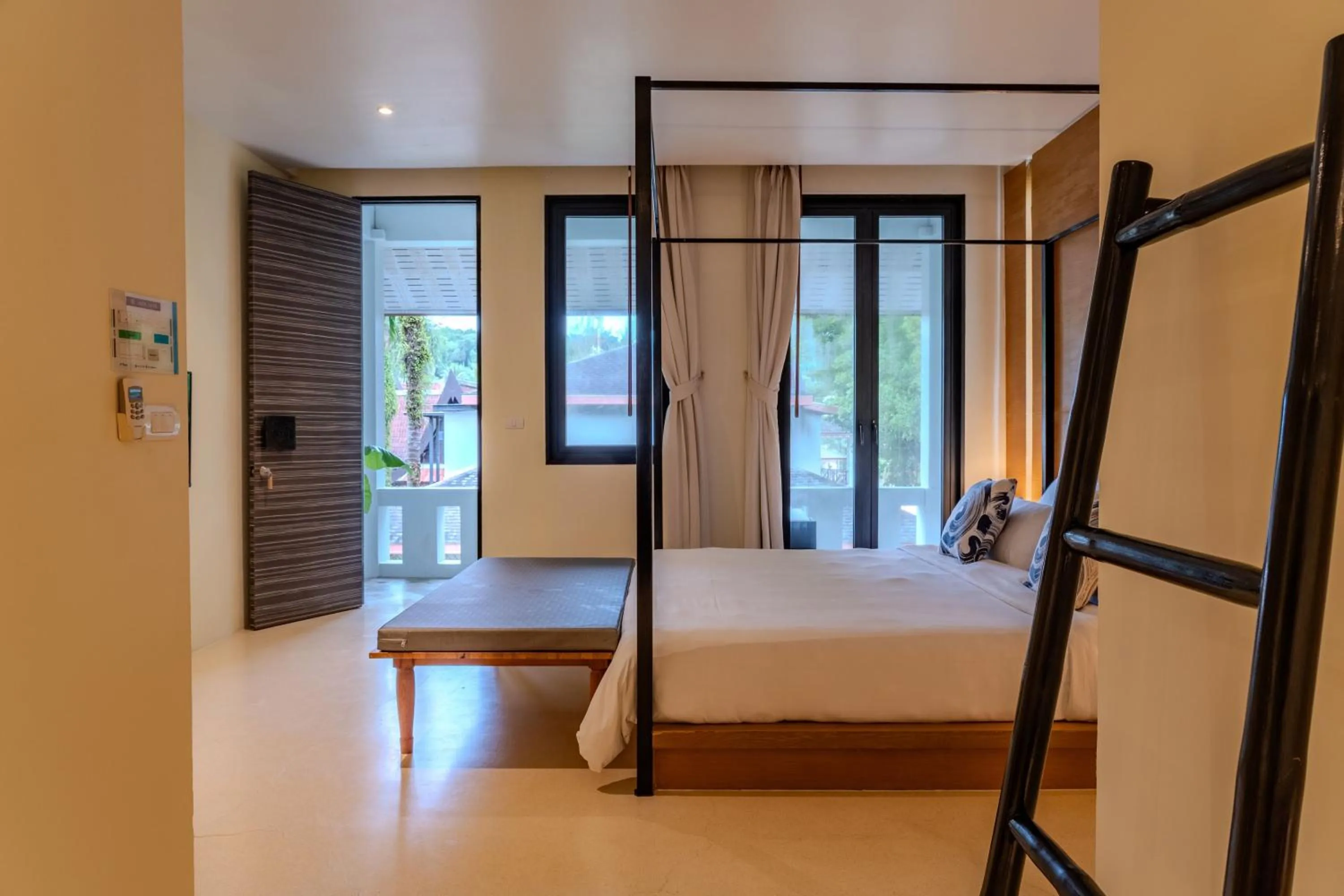 Bed in The Anda Mani Khaolak Beachfront Villas - Adult only