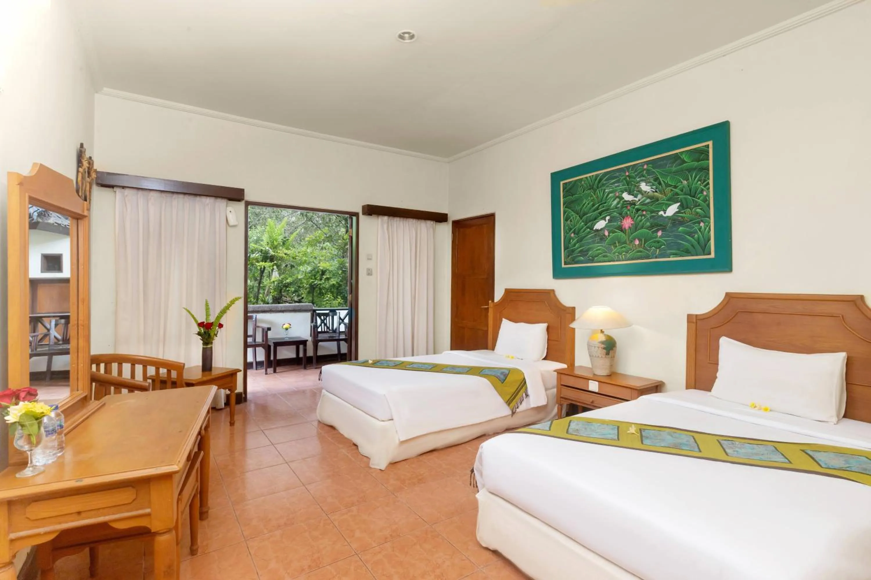 Photo of the whole room, Bed in Dewi Sinta Hotel and Restaurant