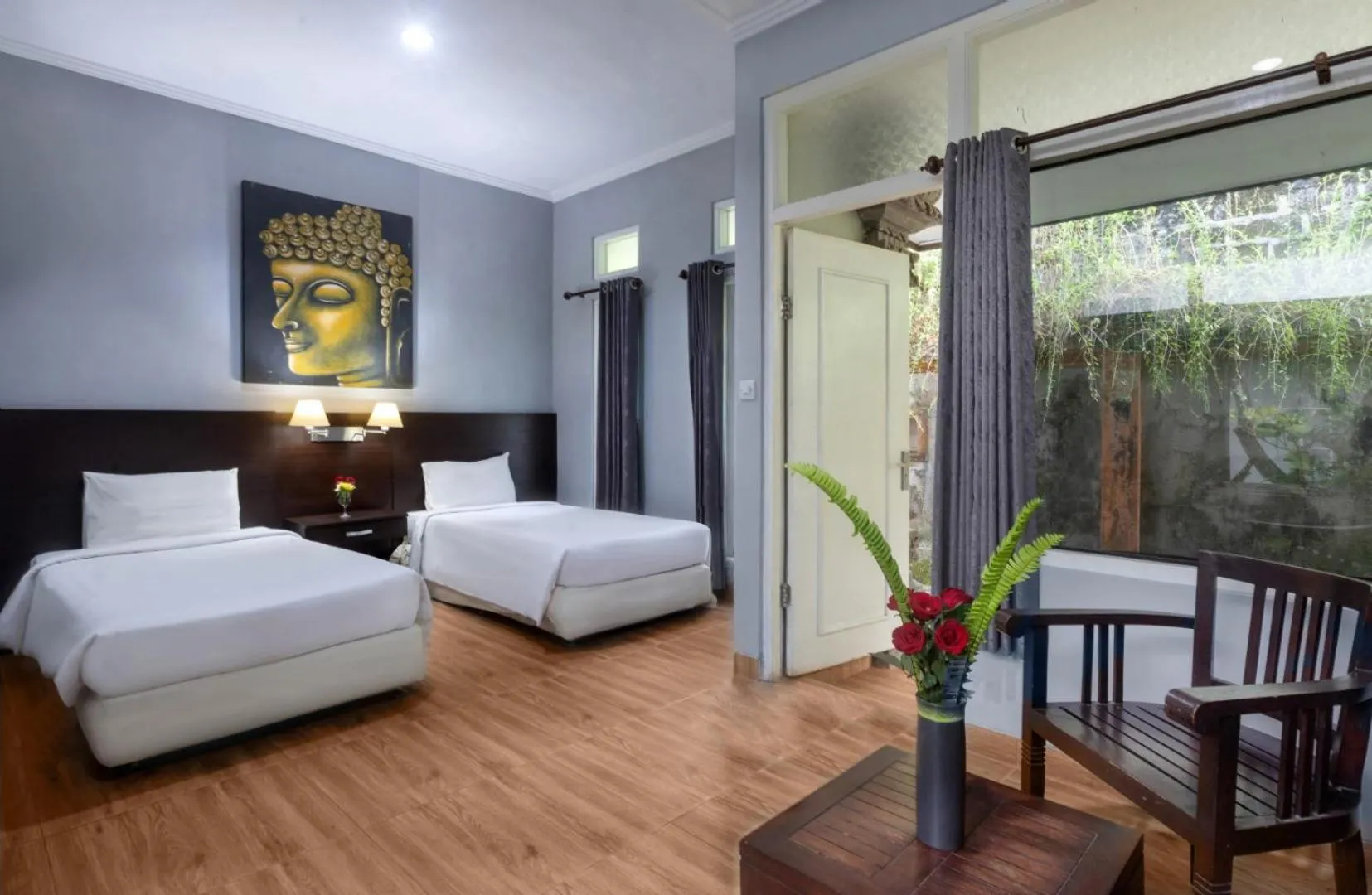 Photo of the whole room, Bed in Dewi Sinta Hotel and Restaurant