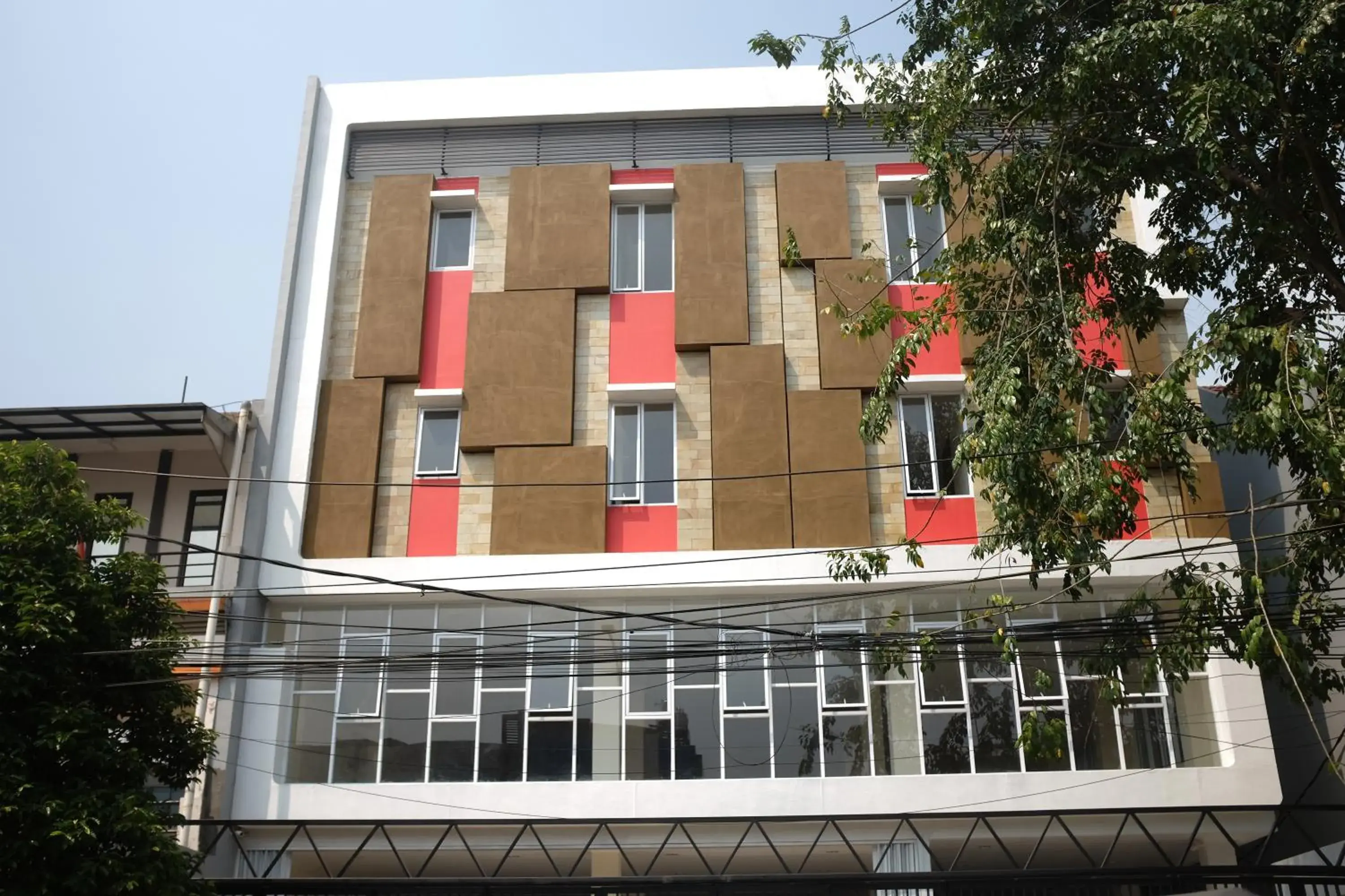 Facade/entrance in RedDoorz Plus near Mall Ciputra Jakarta Facade/entrance in RedDoorz Plus near Mall Ciputra Jakarta