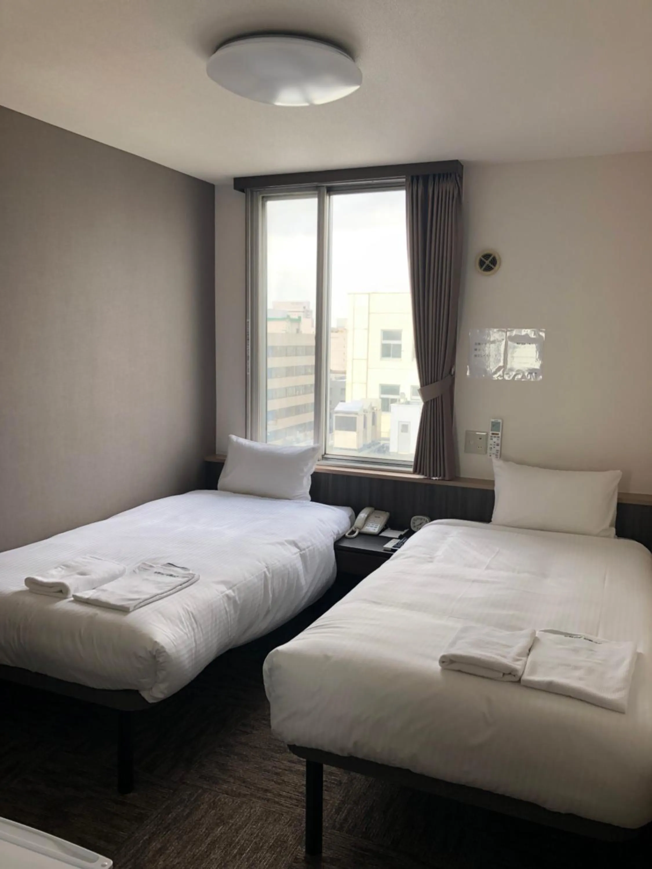 Bed in Hotel Tetora Asahikawa Station