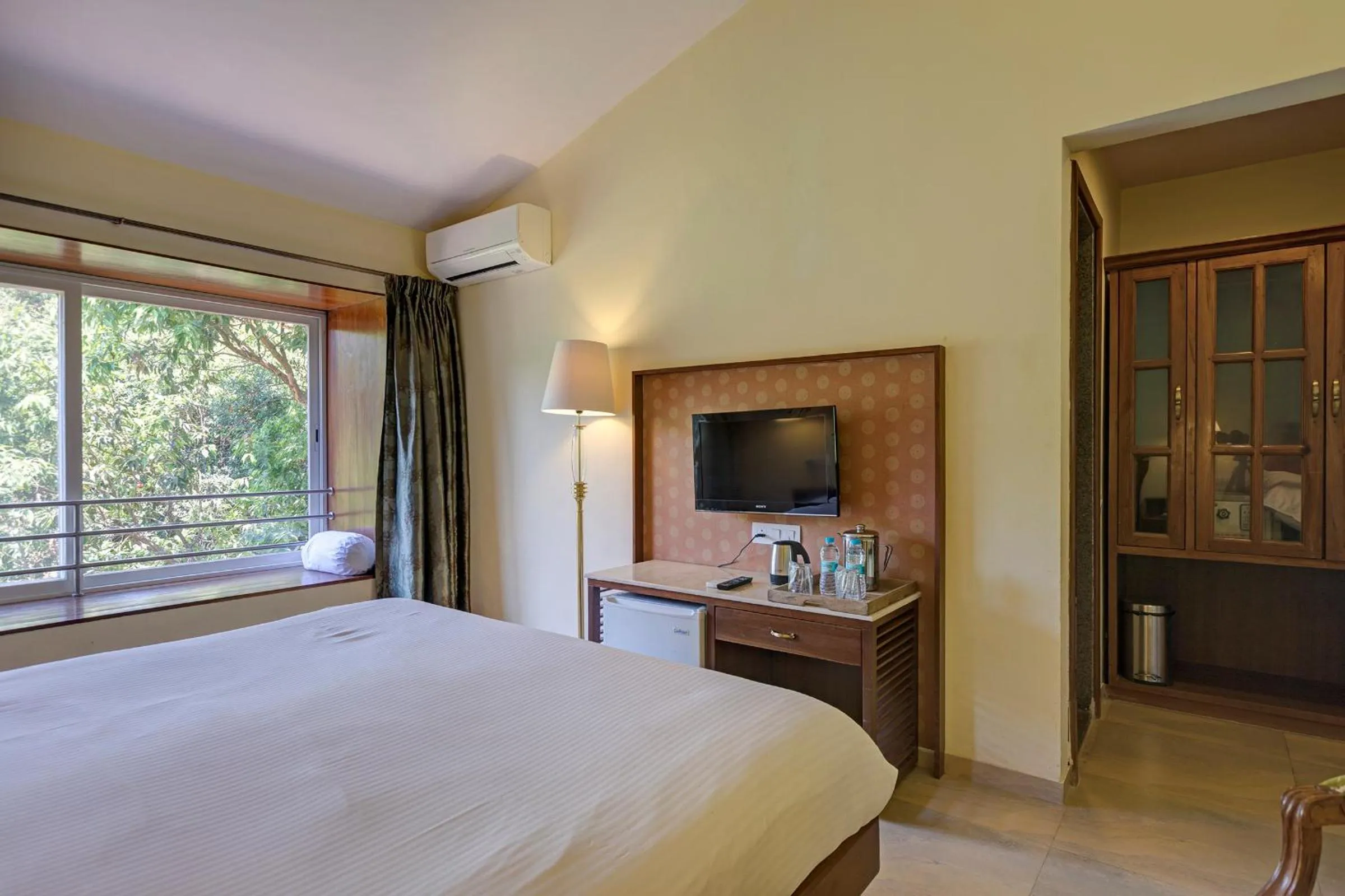 Bed in Ramsukh Resorts and Spa