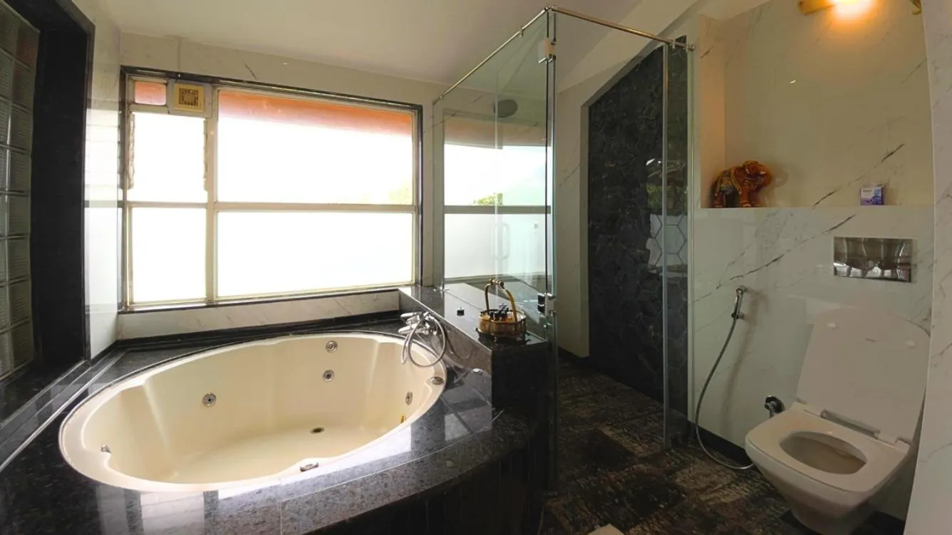 Shower in Ramsukh Resorts and Spa