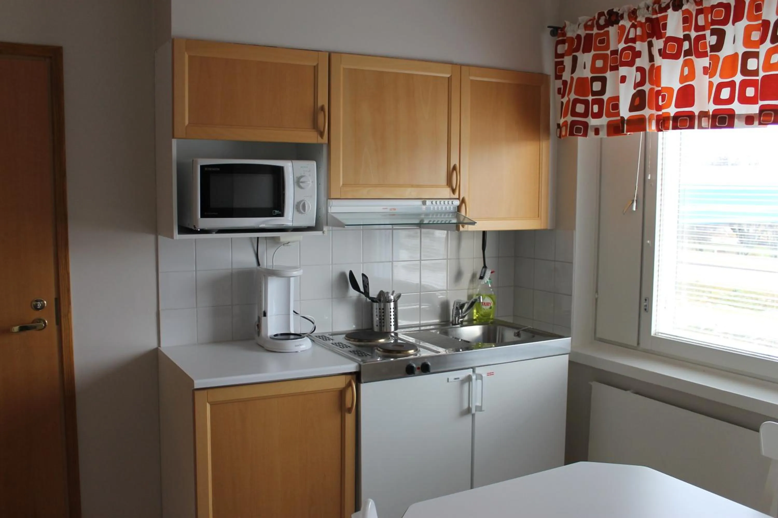 Kitchen or kitchenette in Motelli Jätkänkolo