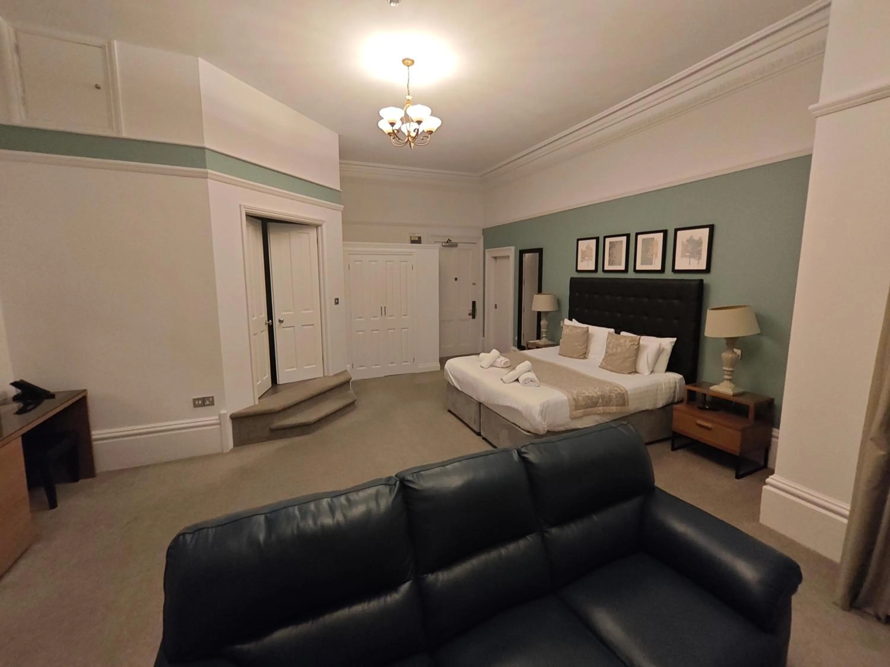 Seating area, Bed in Trenython Manor Resort