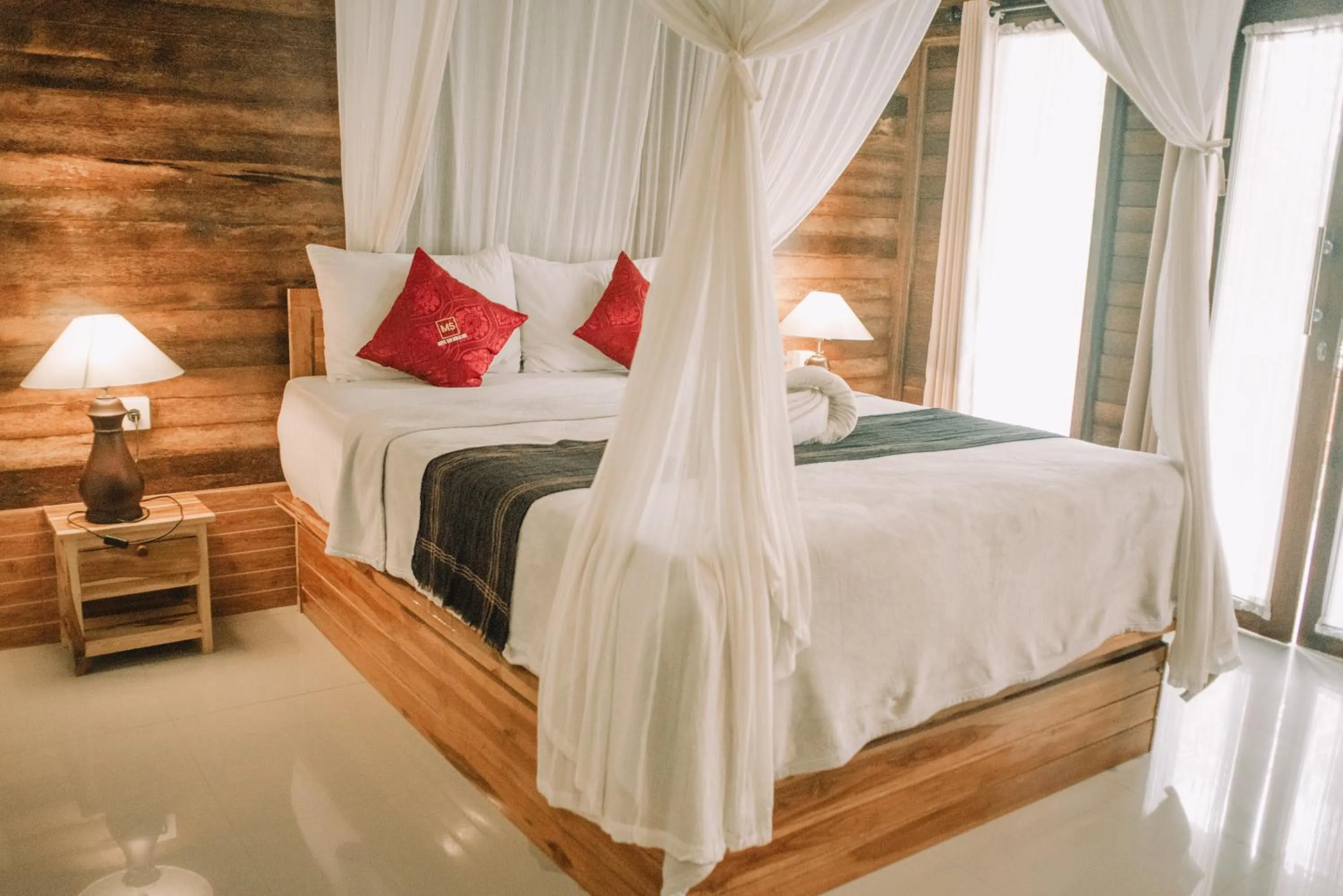Bed in Mertasari Bungalows