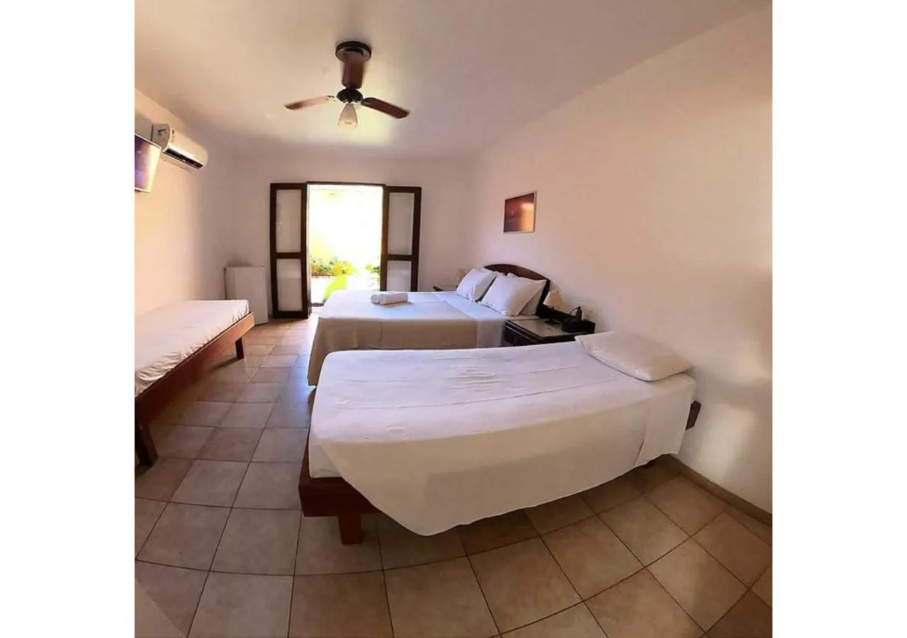 Bed in Pousada Casa Amarela