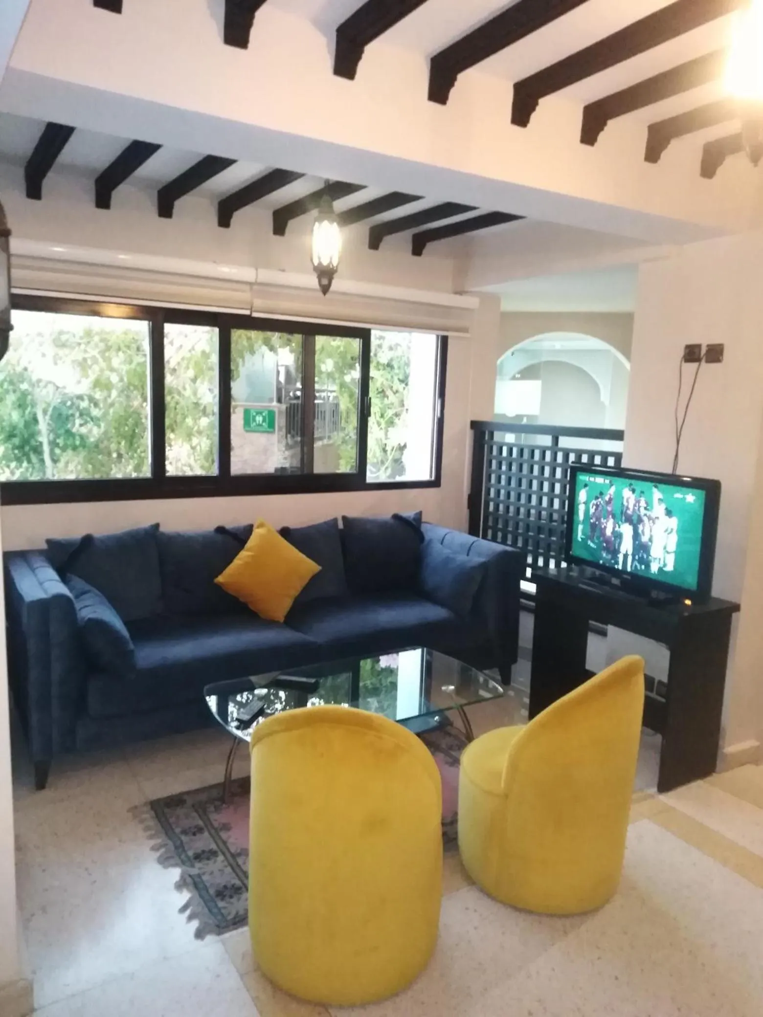 Communal lounge/ TV room in Suite Hotel Tilila