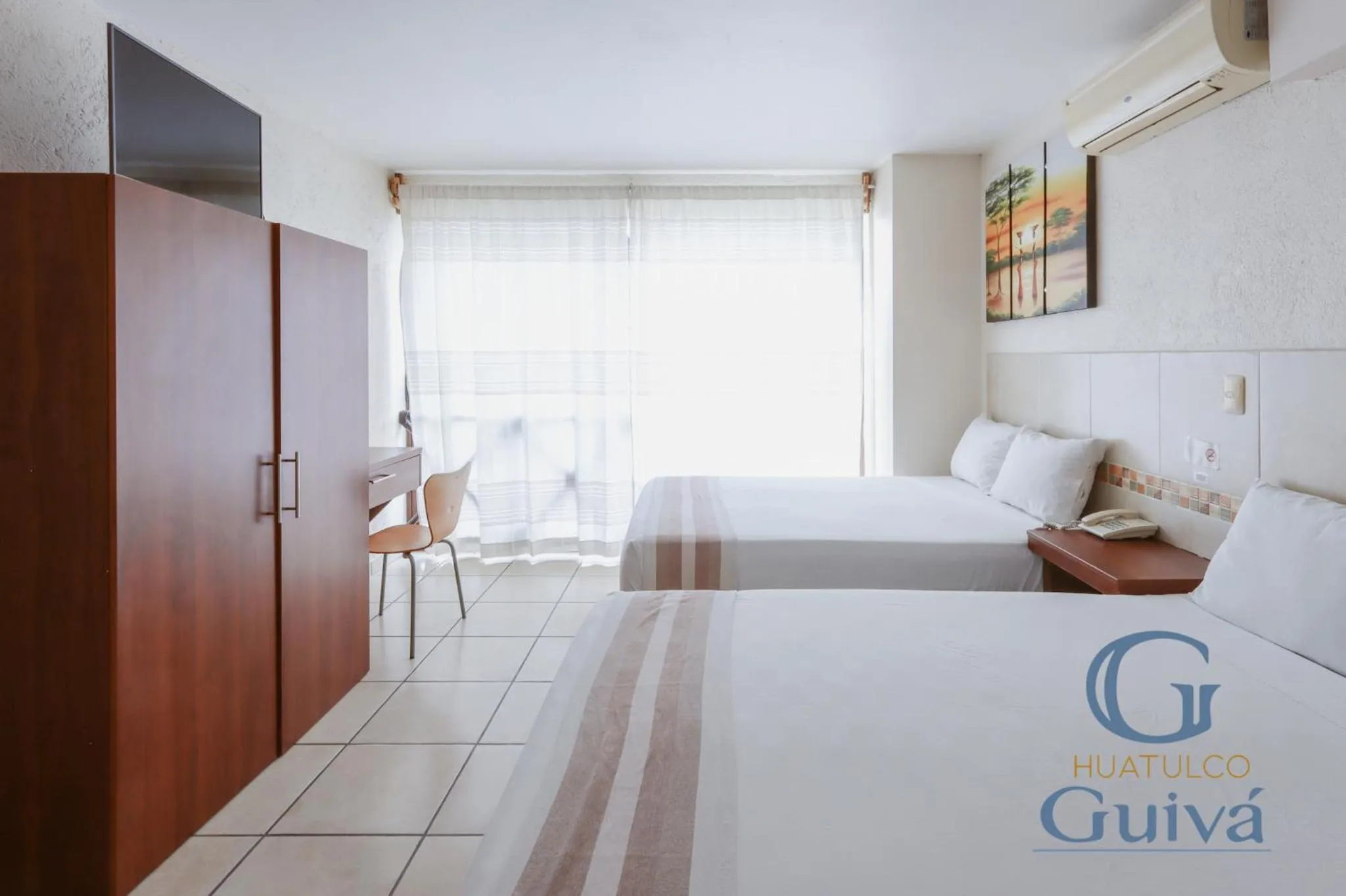 Bed in Hotel Guivá Huatulco