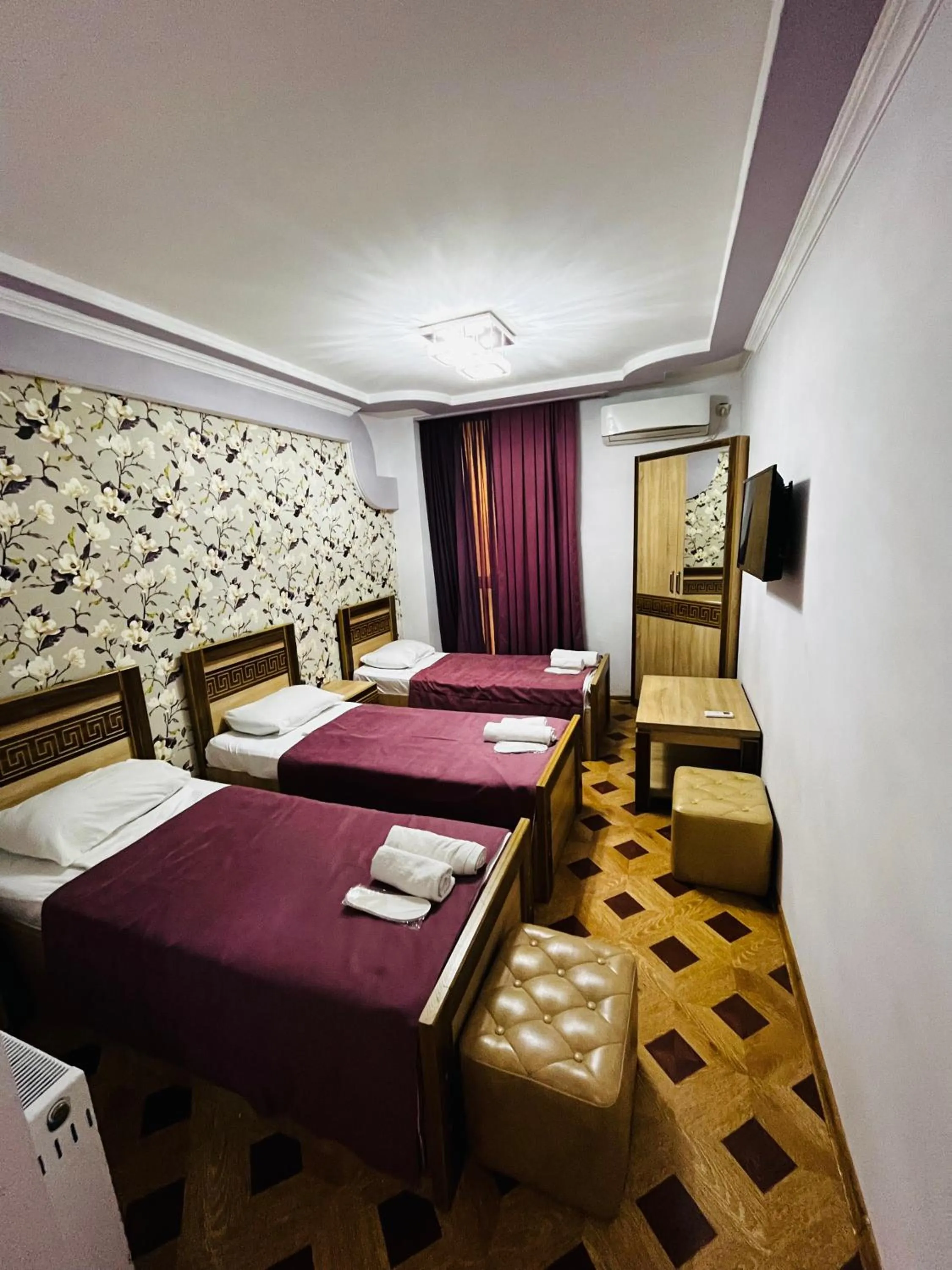 Communal lounge/ TV room, Bed in Georgian Palace Hotel