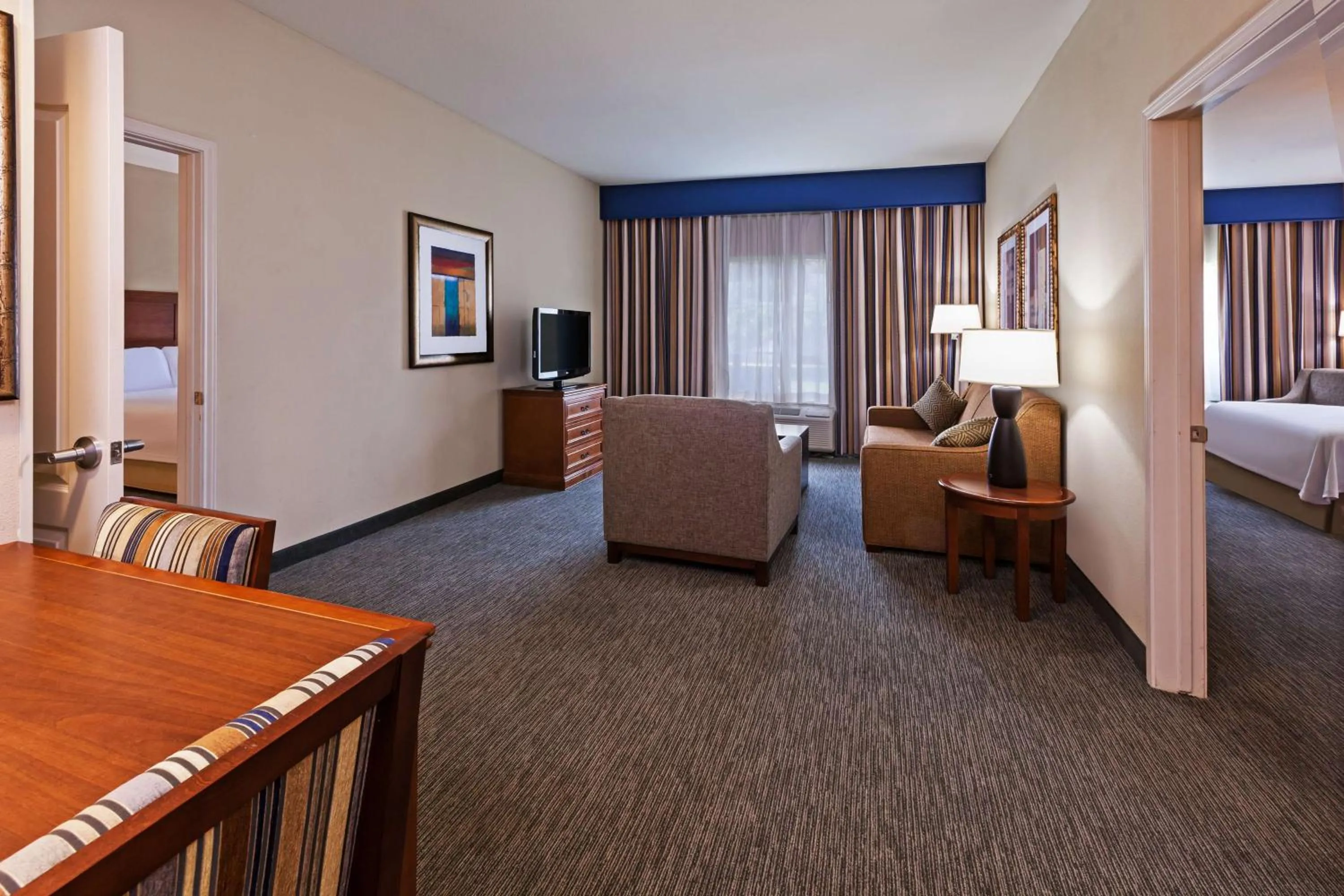 Living room, Bed in Homewood Suites Laredo at Mall Del Norte