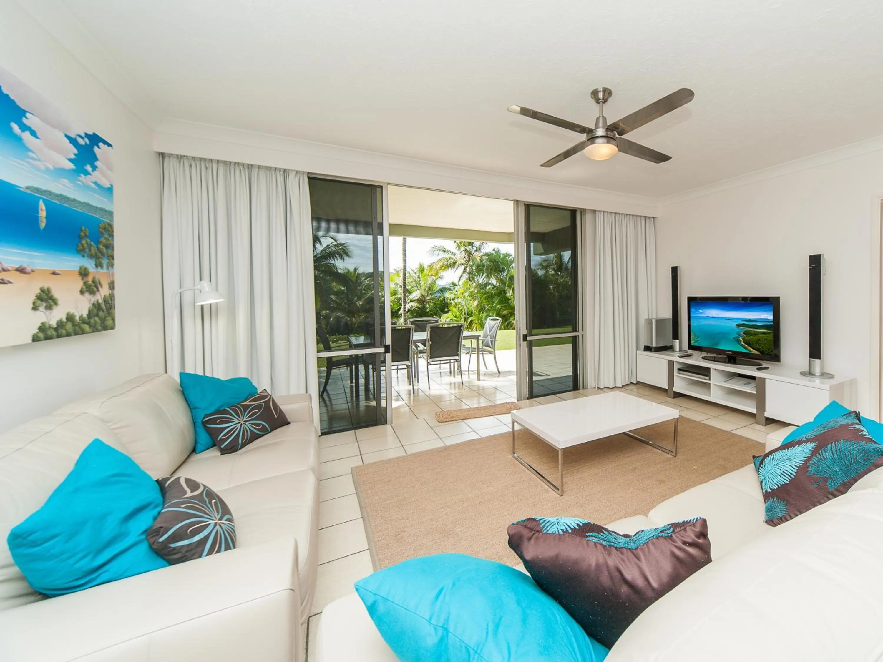 Communal lounge/ TV room in Hamilton Island Holiday Homes
