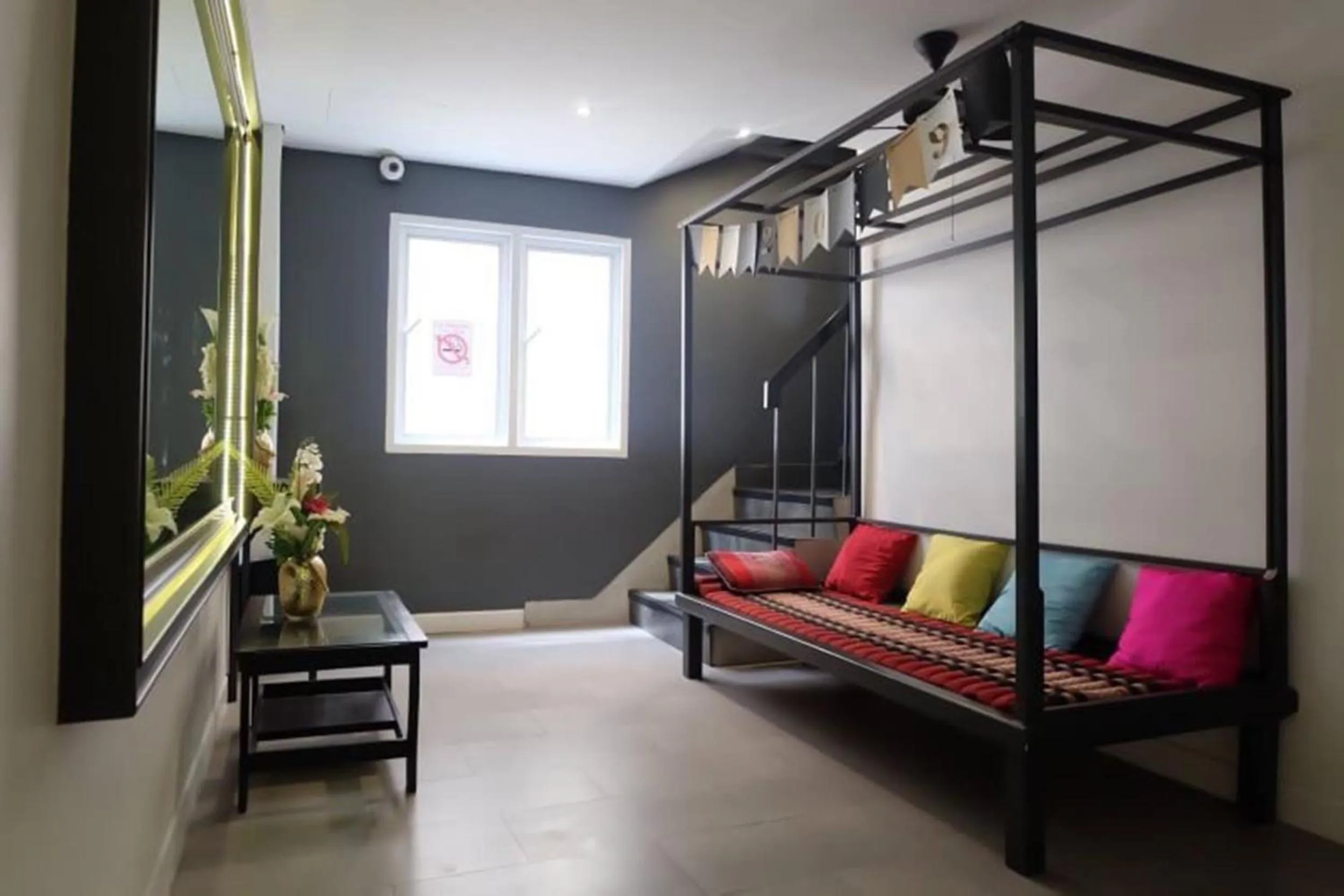 Seating area, Bed in Four Sisters Homestay