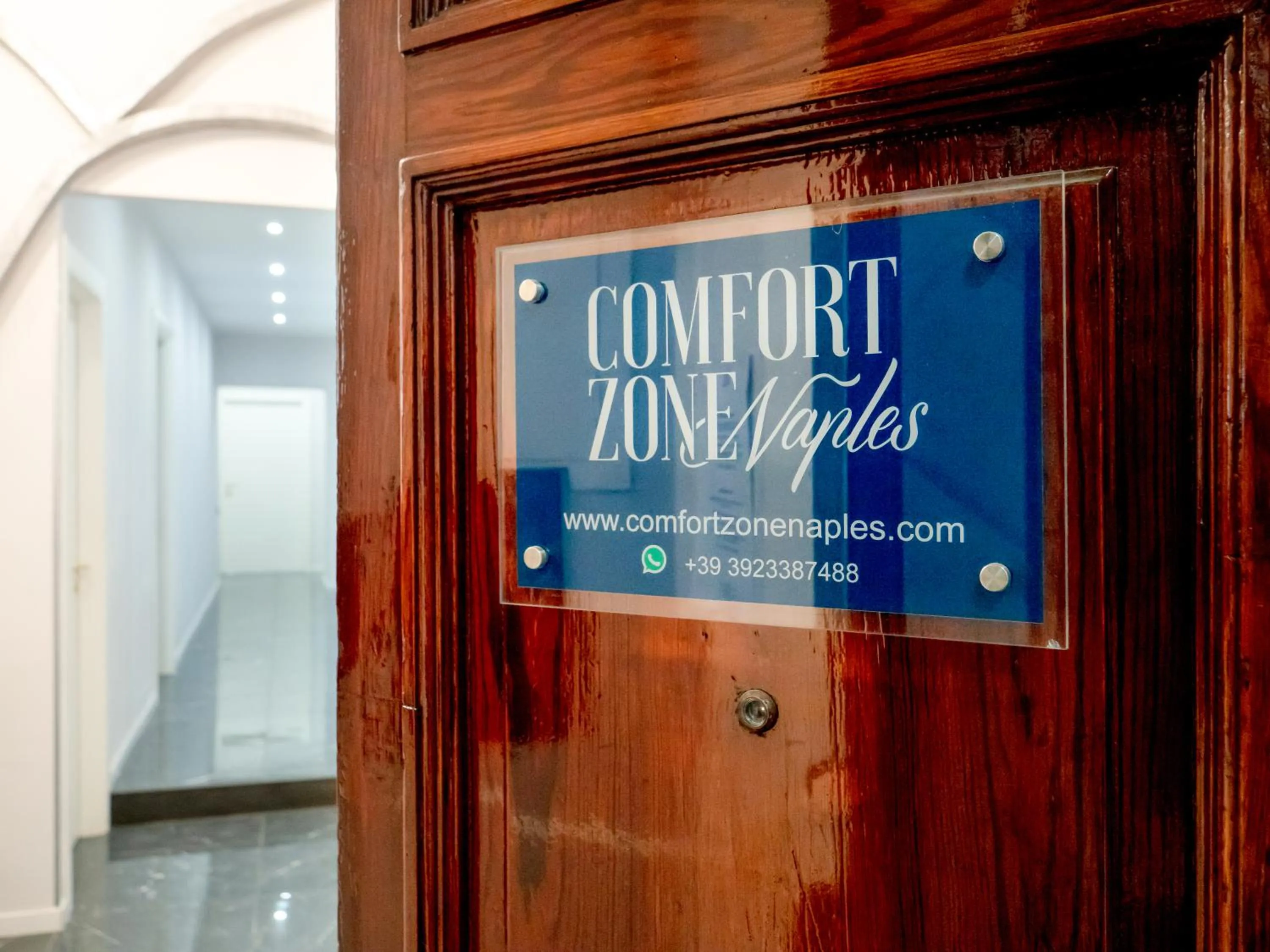 Property logo or sign in Comfort Zone Naples