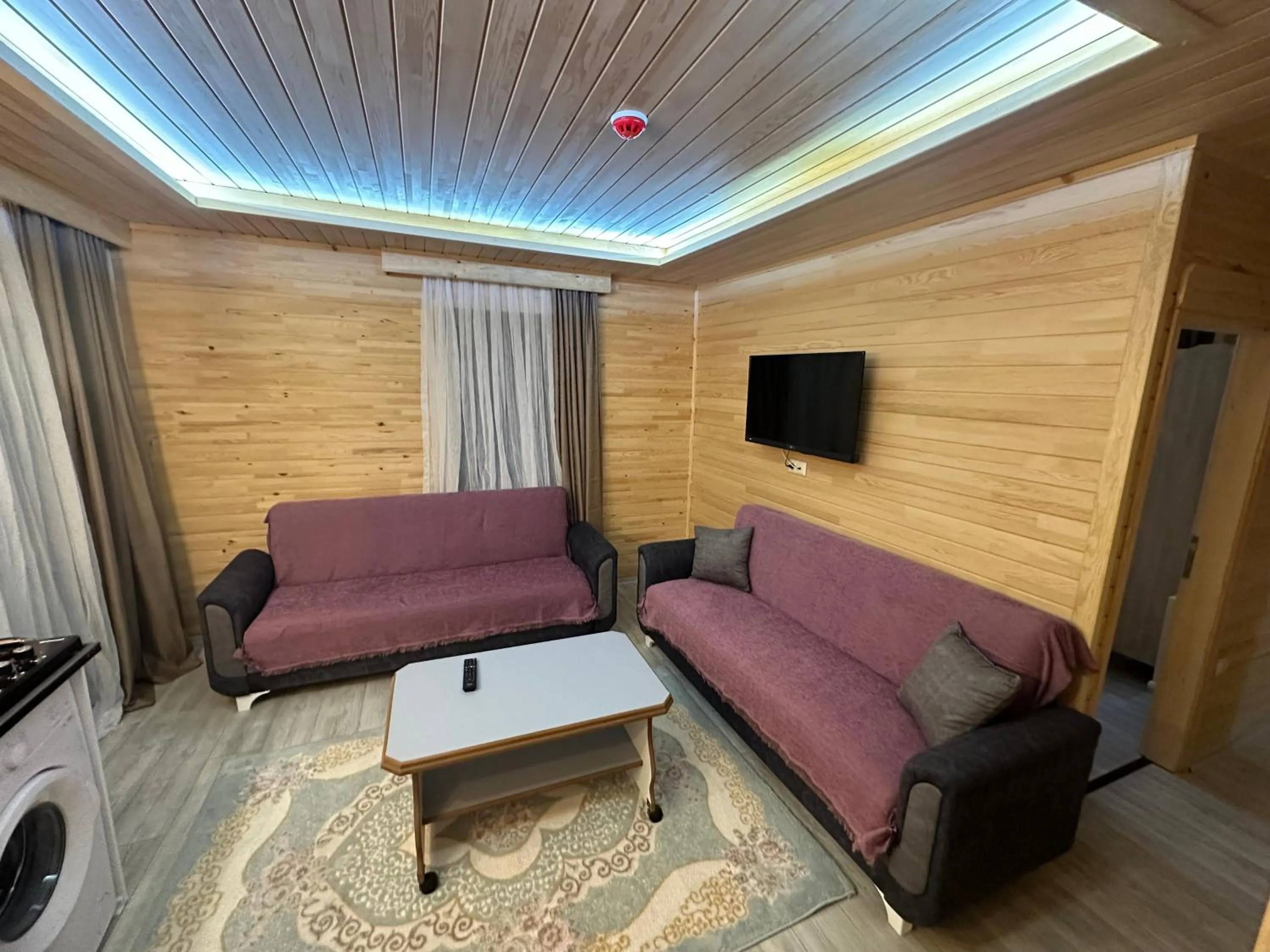 Communal lounge/ TV room in Haros Suite Hotel